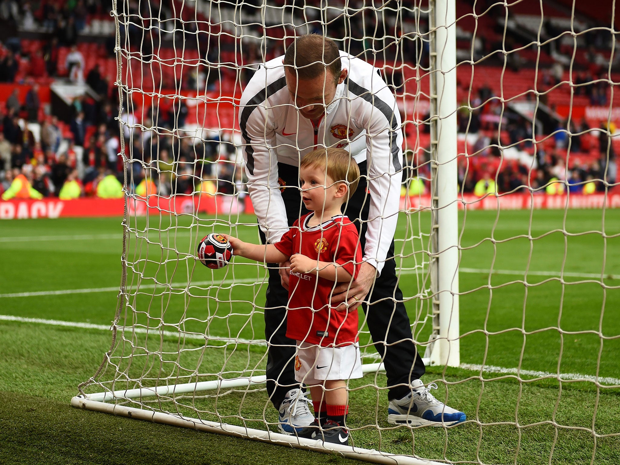 Wayne Rooney and son Klay play in the goal after the Premier League match between Manchester United and Arsenal