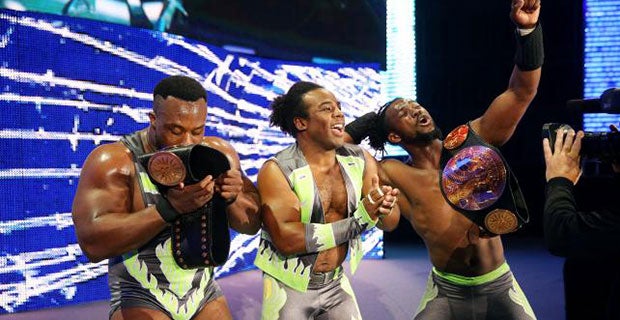 The New Day celebrate their victory over Cesaro and Tyson Kidd