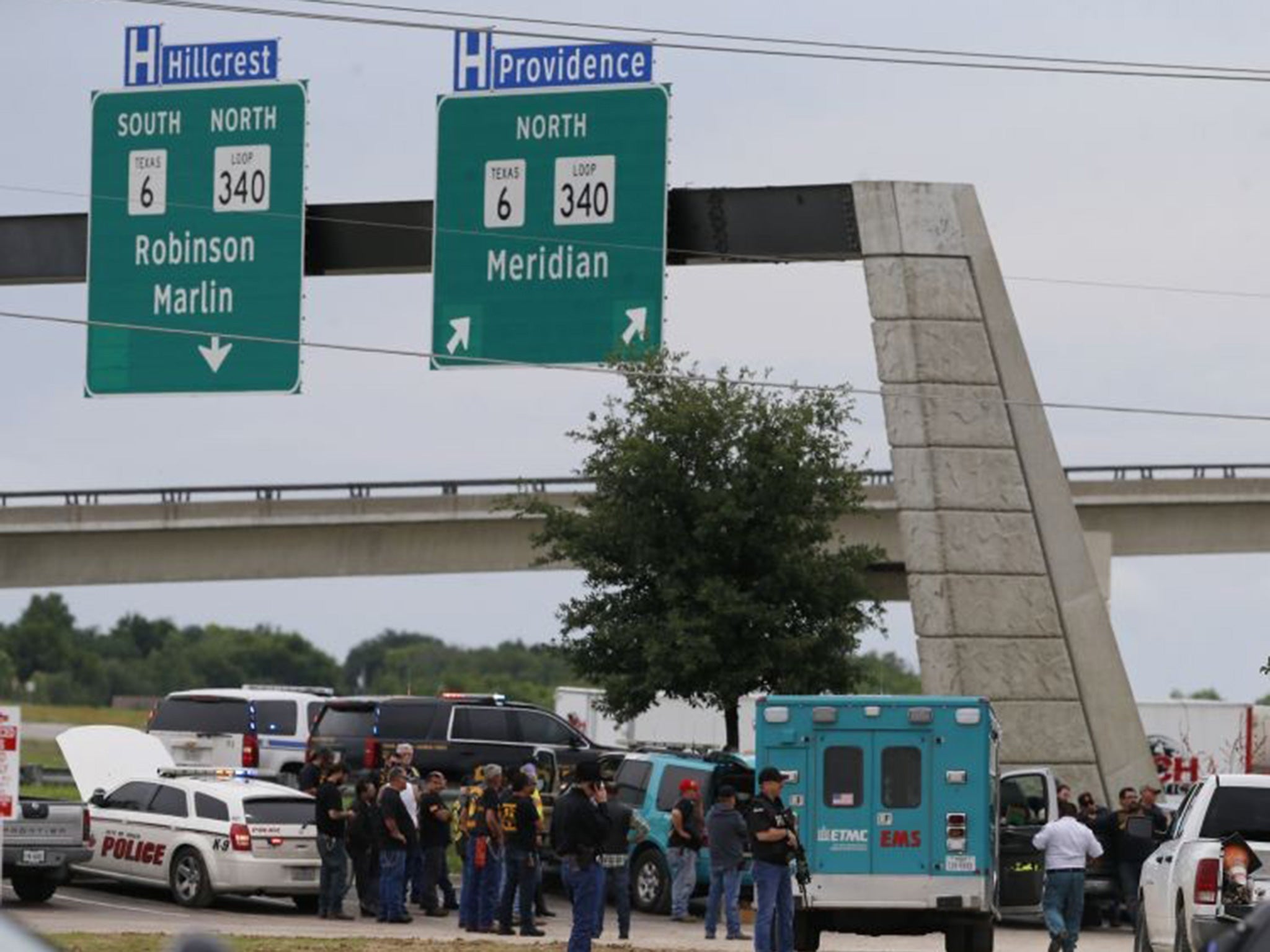 Authorities investigate a scene near a Twin Peaks restaurant in Waco, Texas.