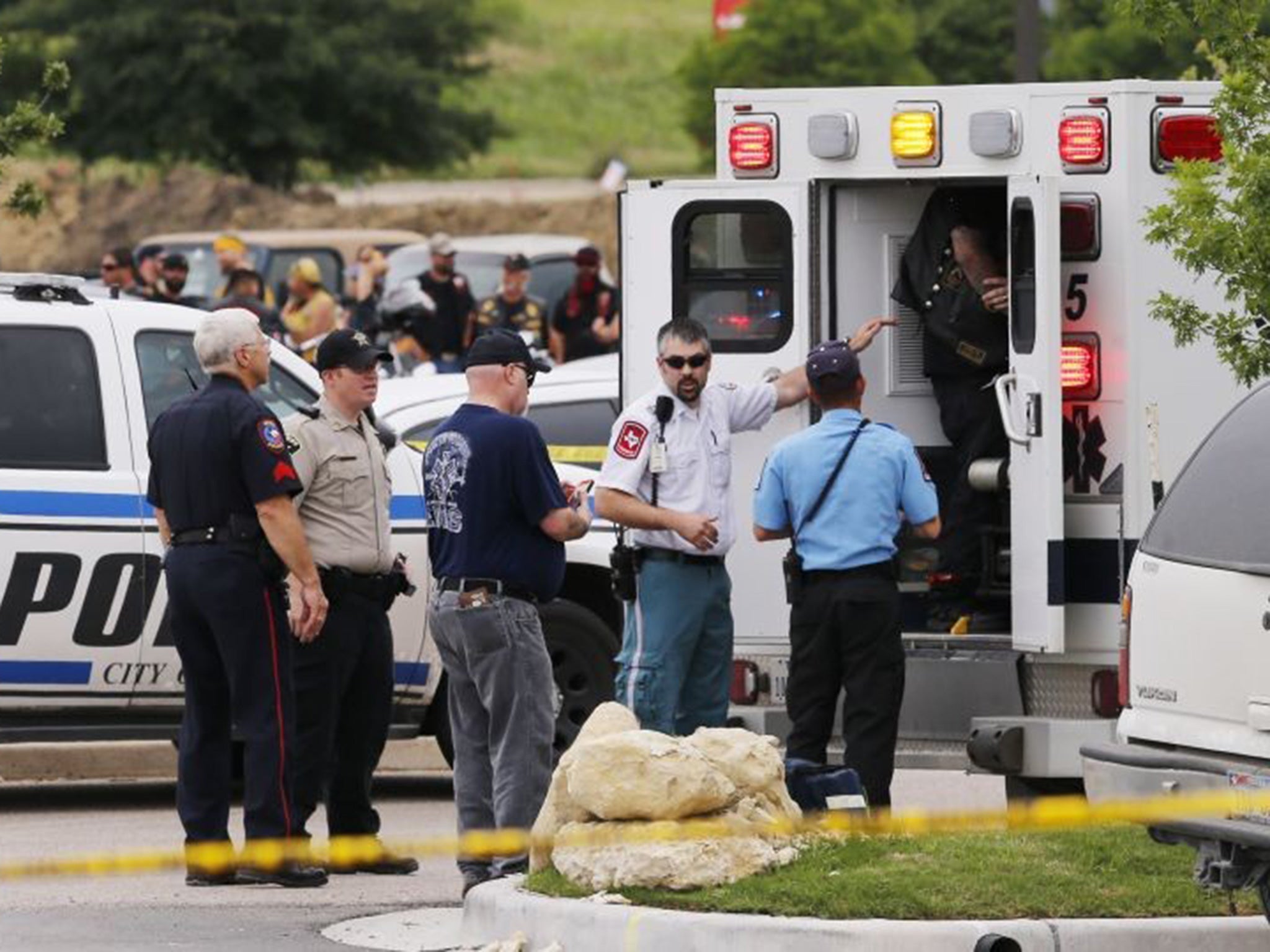 Emergency responders tend to a wounded person near a Twin Peaks restaurant.