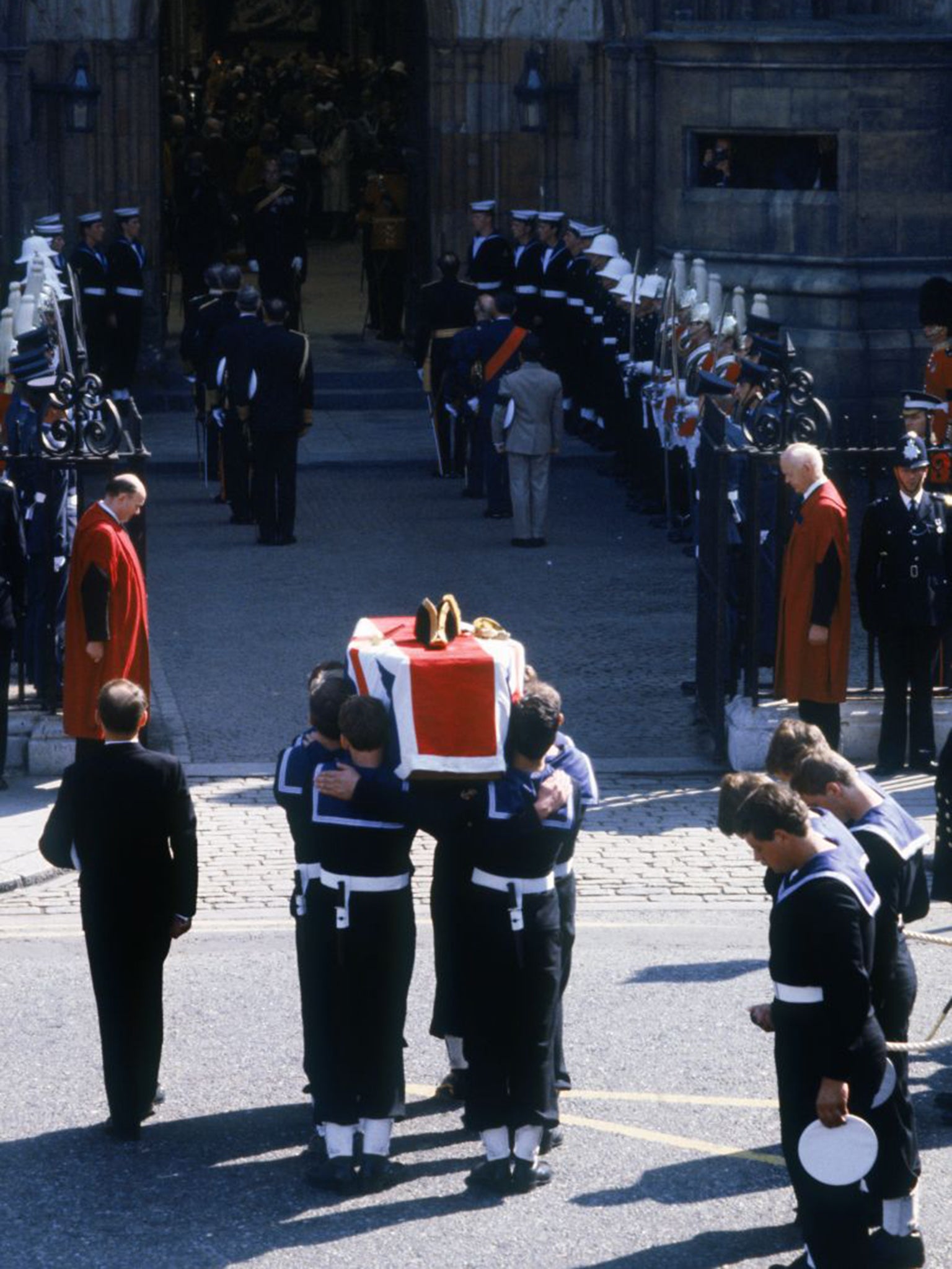 The flag-draped coffin of Lord Mountbatten is carried into Westminster Abbey at his state funeral on 5th September 1979