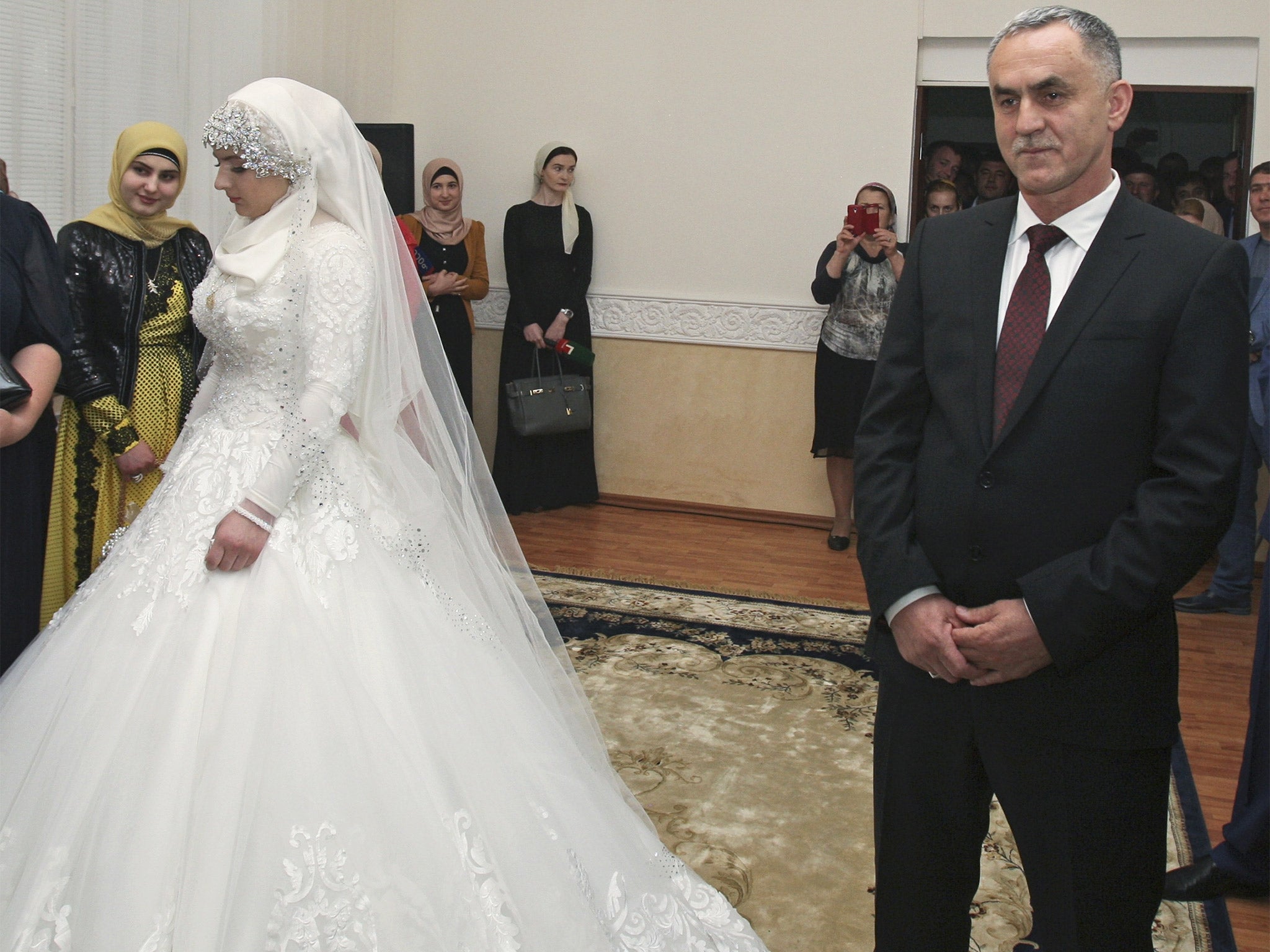 Kheda Goilabiyeva, 17, marries police chief Nazhud Guchigov in Grozny on Saturday in what some claim is a forced marriage