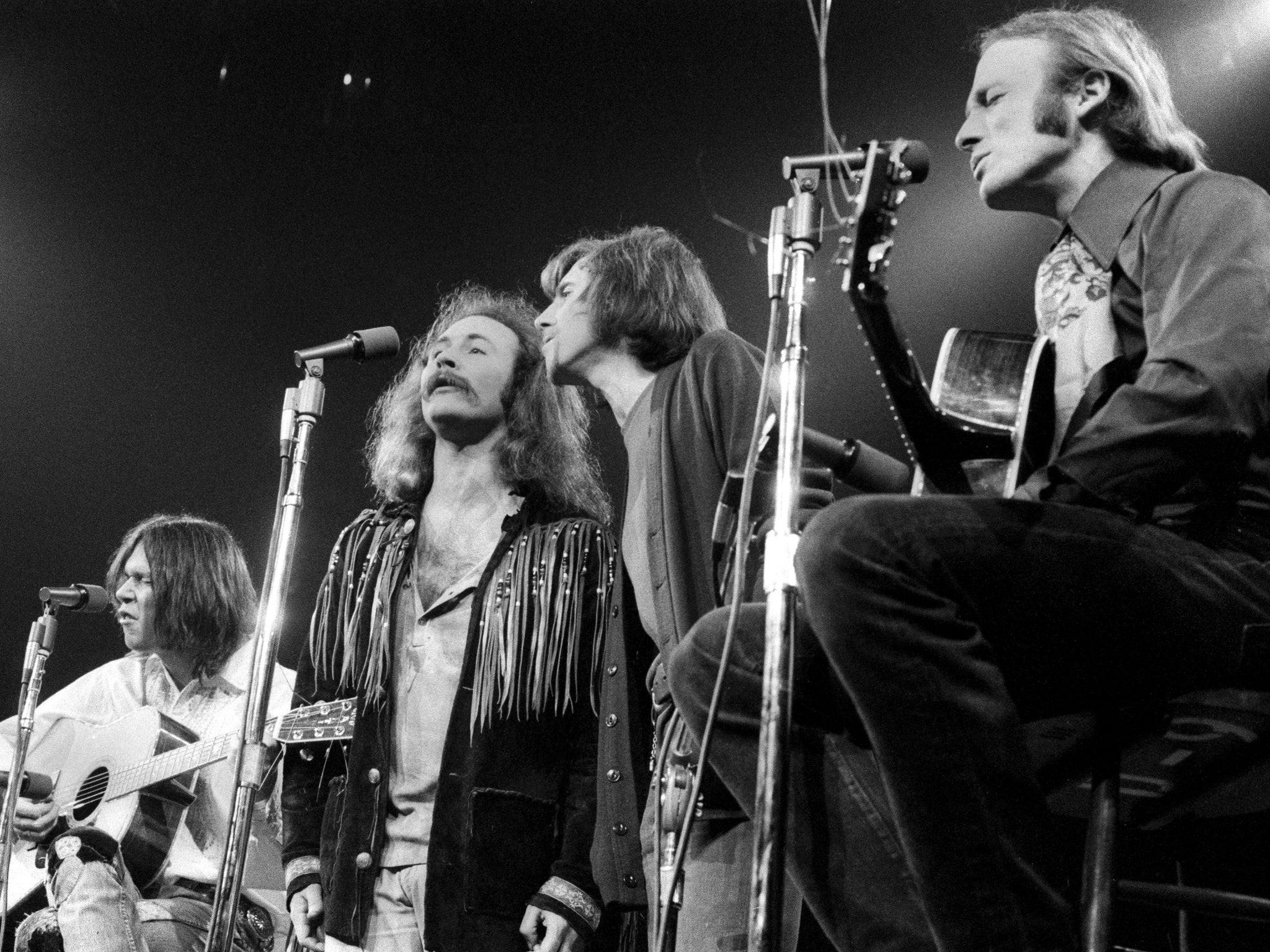 Crosby, Stills, Nash and Young performing in the Seventies