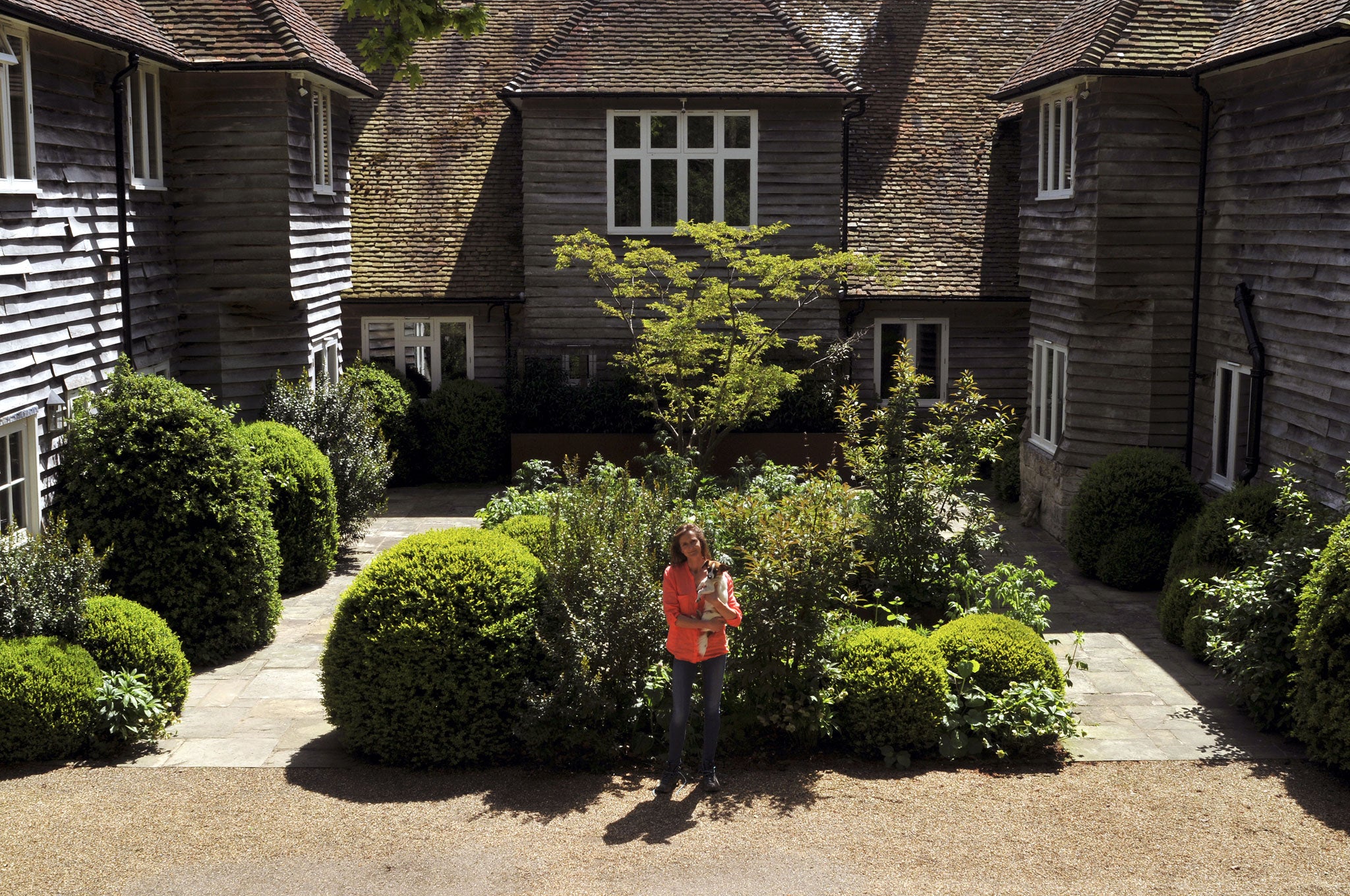 Vanessa Ringer in her lush, maturing courtyard, 2015