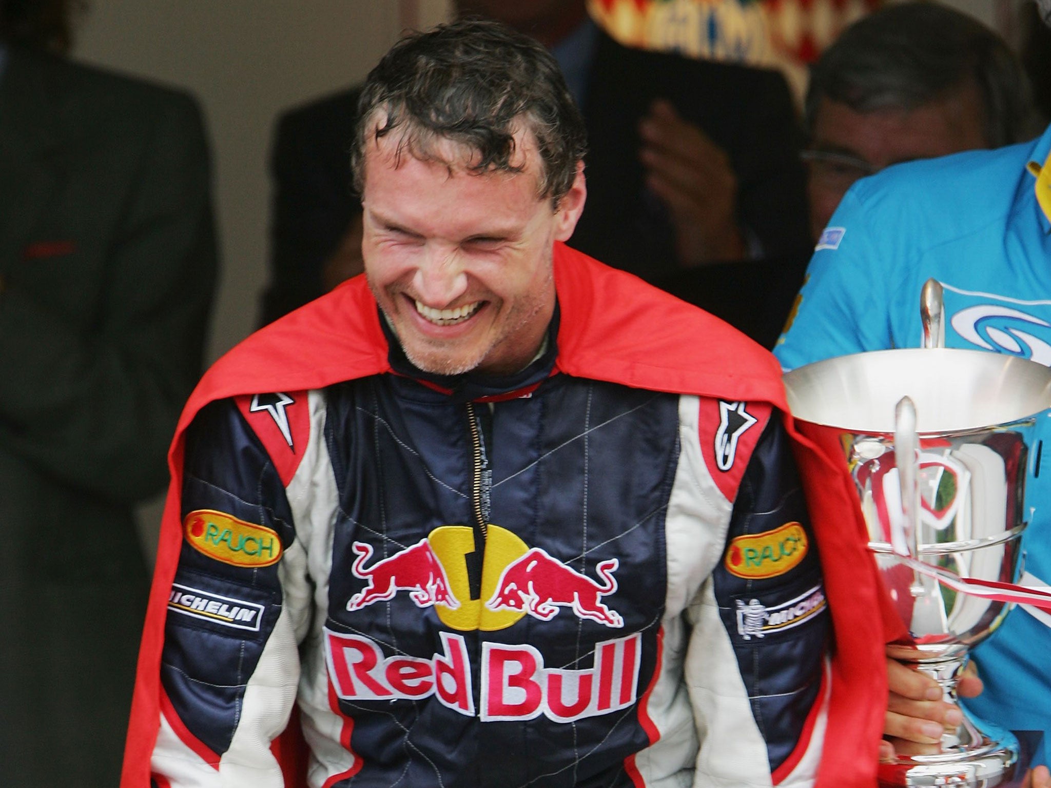 David Coulthard celebrates his third place in 2008 with a Superman cape