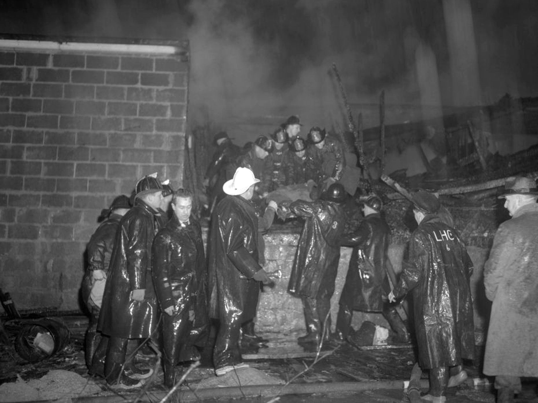 Tragedy: Firemen at the scene of the 1952 American Airlines crash in Elizabeth, New Jersey, in 1952