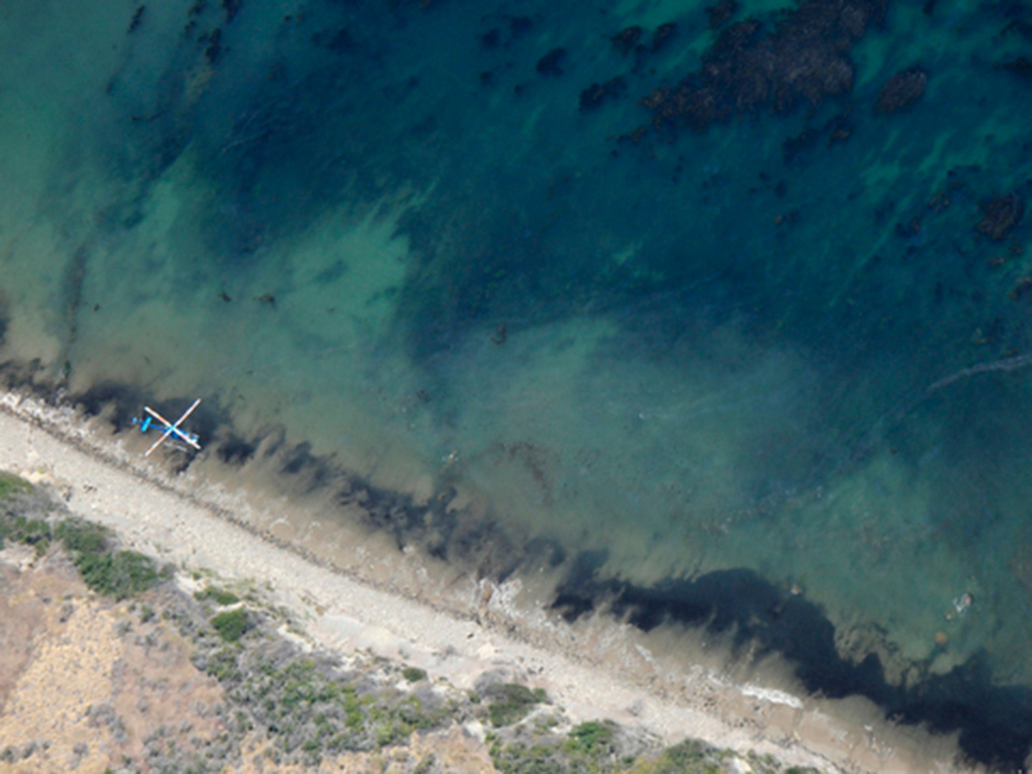 An oil spill moves along the Santa Barbara coastline