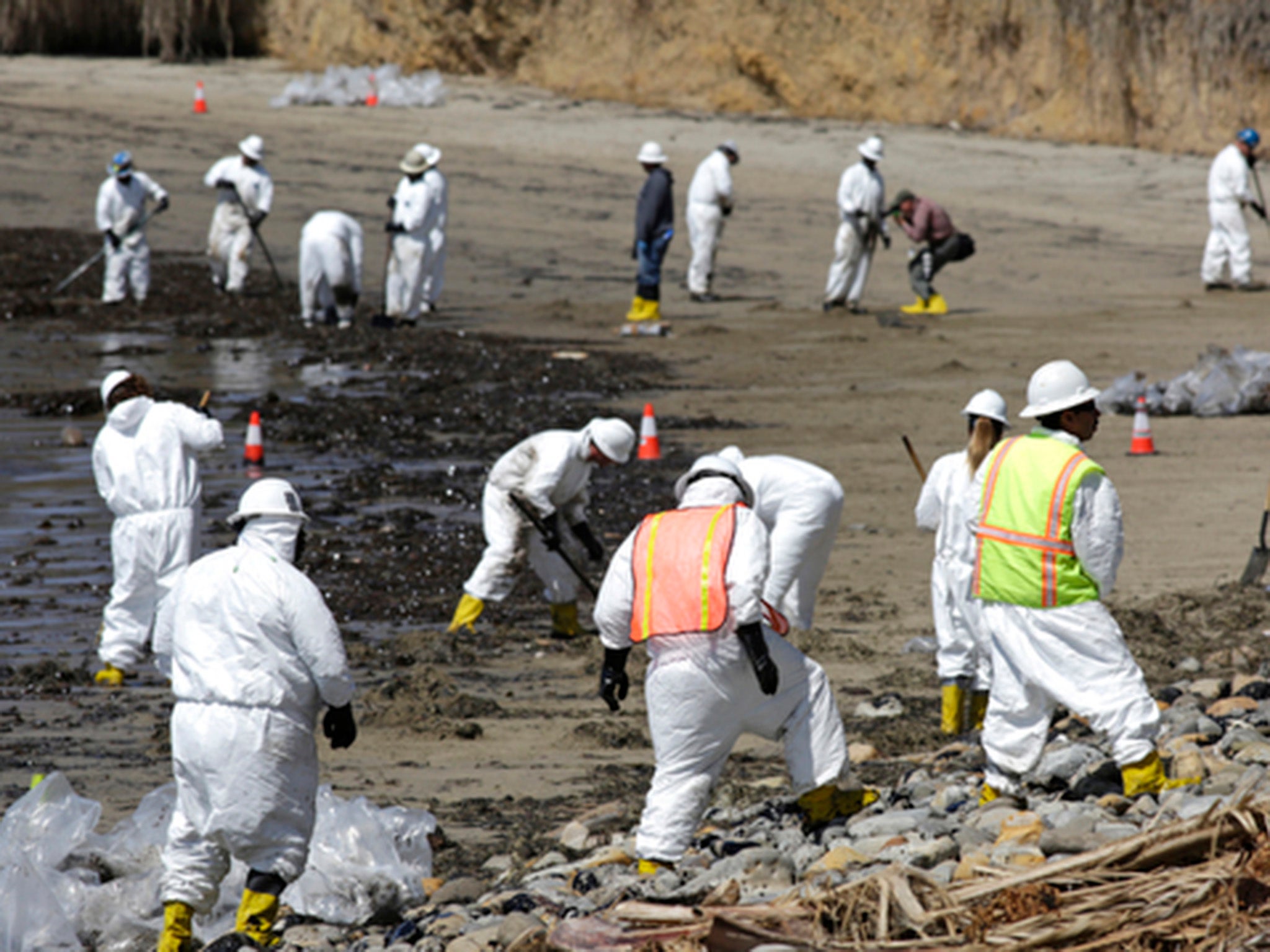 Oil is being physically moved from a beach on the Santa Barbara coastline as part of the cleanup effort.