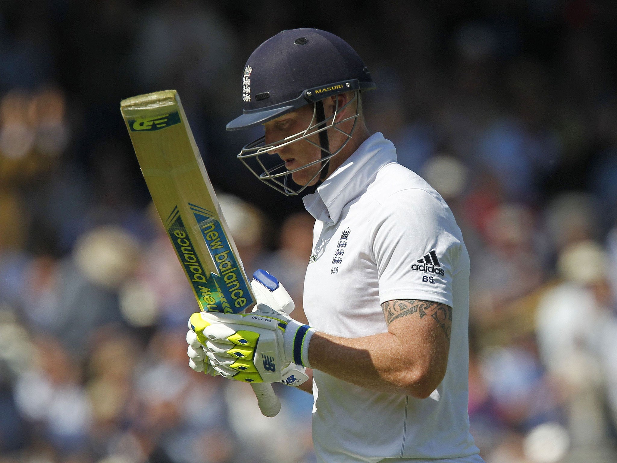 Englands Ben Stokes reacts as he walks back to the pavilion after getting bowled-out for 92 runs