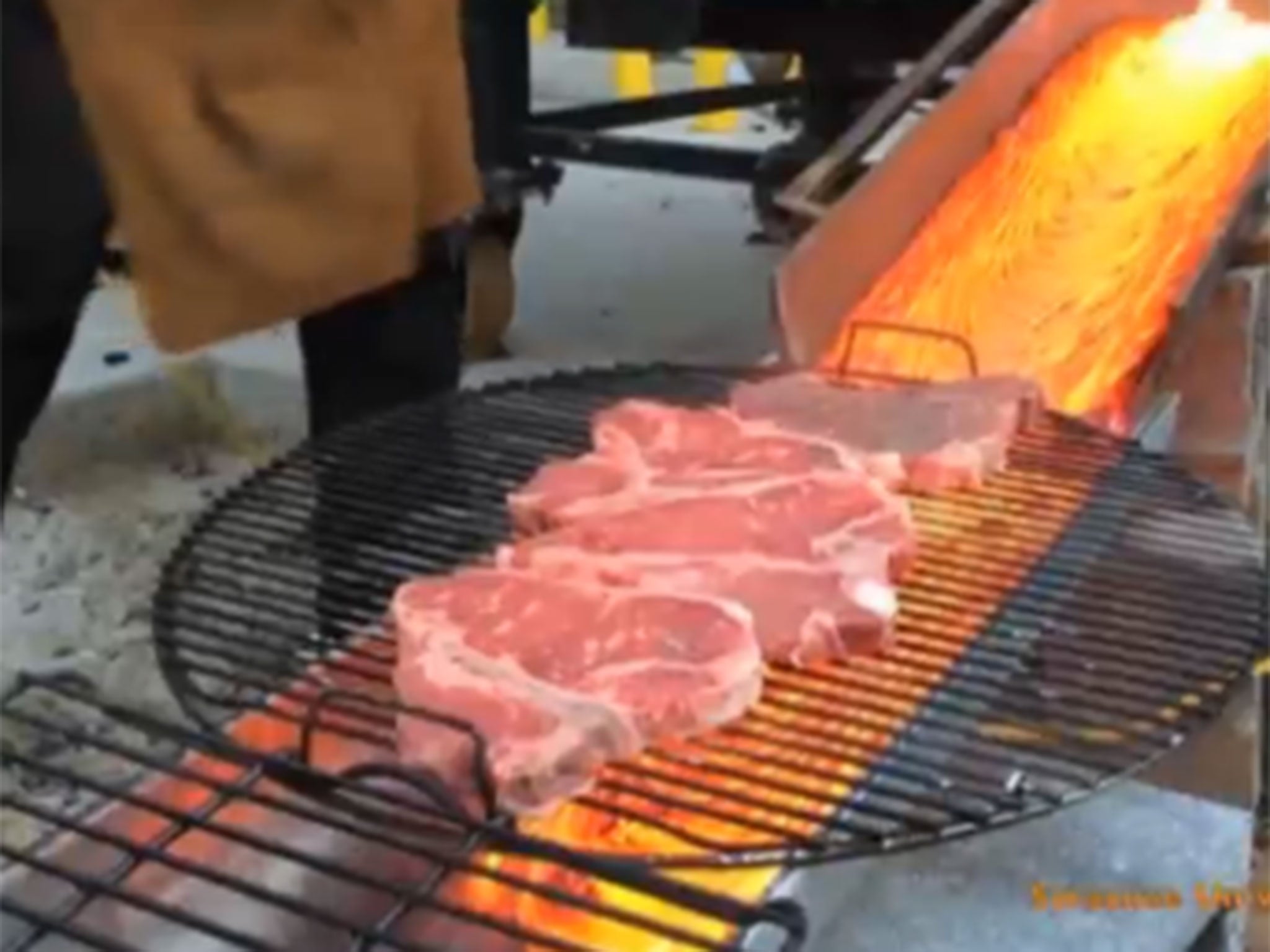 The steaks being grilled by the lava