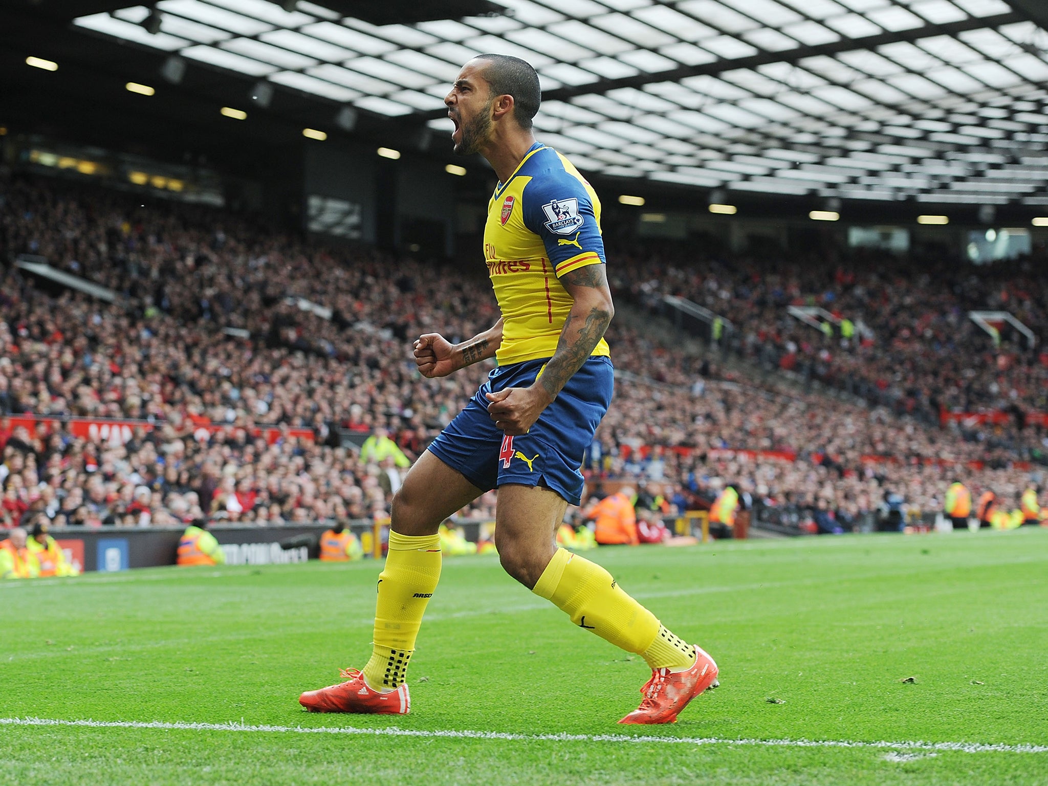 Theo Walcott's deflected strike secured a 1-1 draw at United