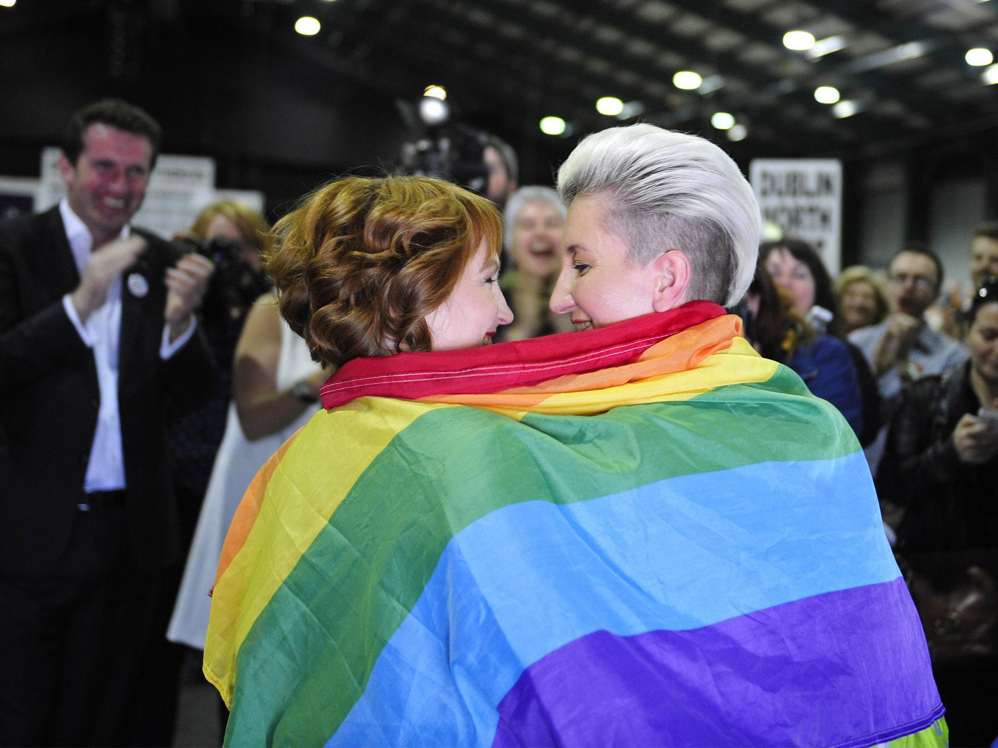 Monnine Griffith and Clodagh Robinson celebrate after early results suggest an overwhelming majority in favour of legalising gay marriage