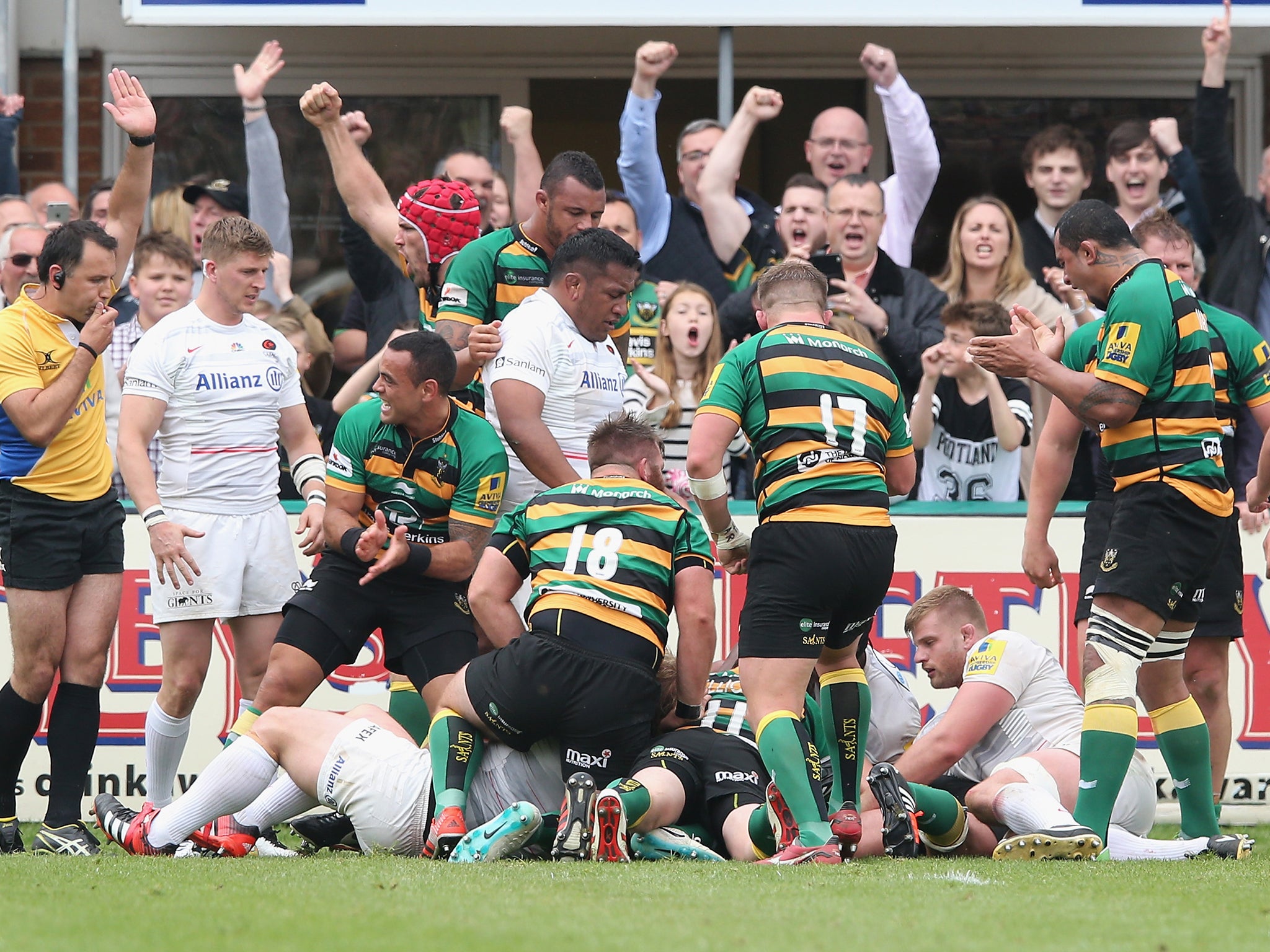 Northampton celebrate after shoving Tom Woo over for a try