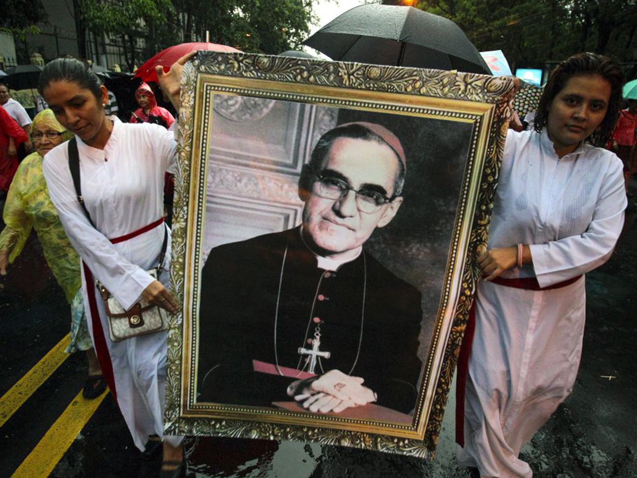 Devotees parade a portrait of Oscar Romero in San Salvador on Friday