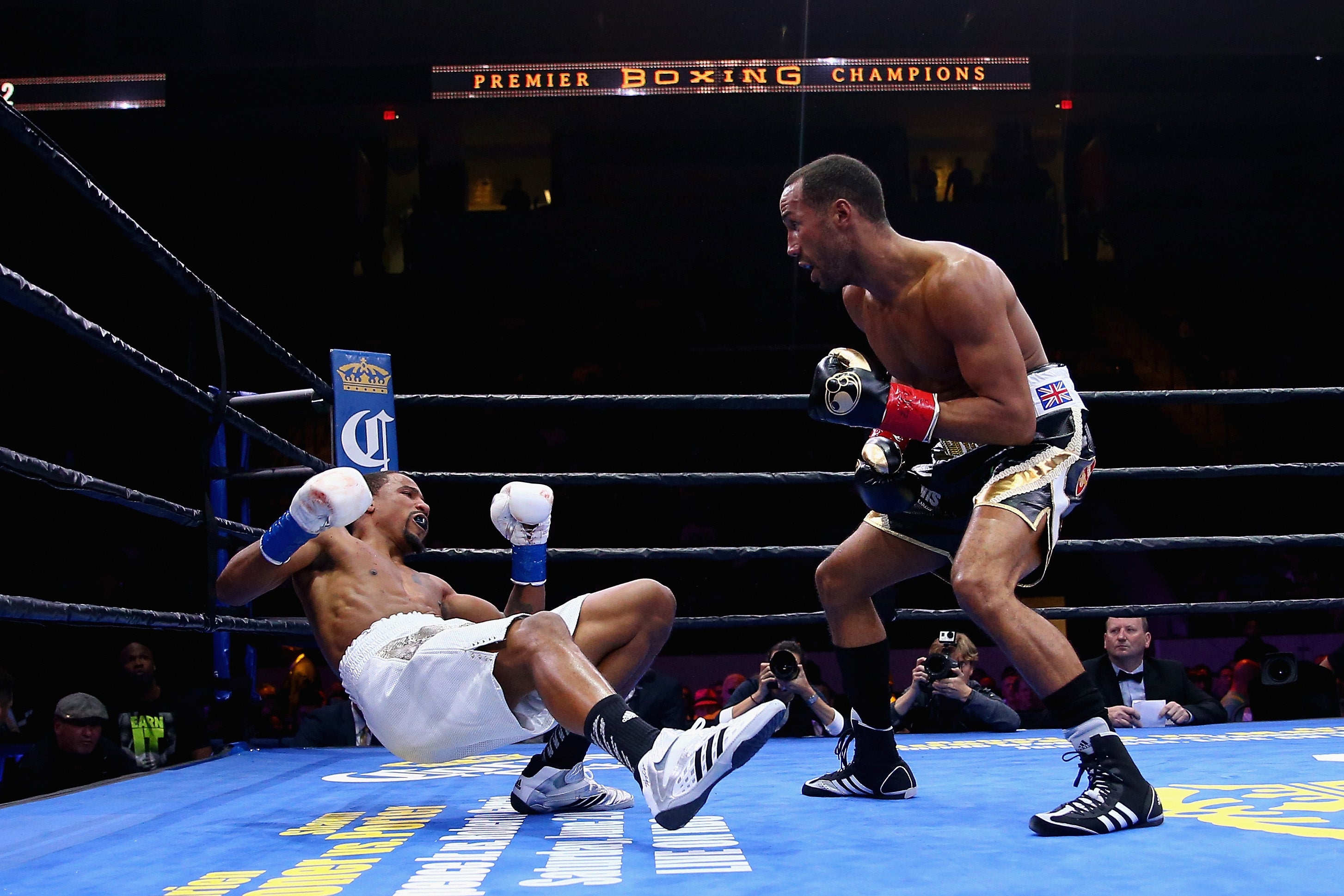 James DeGale knocks down Andre Dirrell during their fight for the super middleweight title.