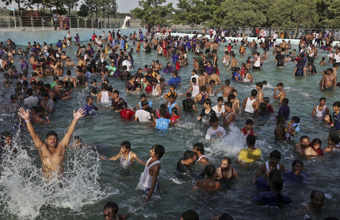 People trying to keep cool at a water park in Hyderabad