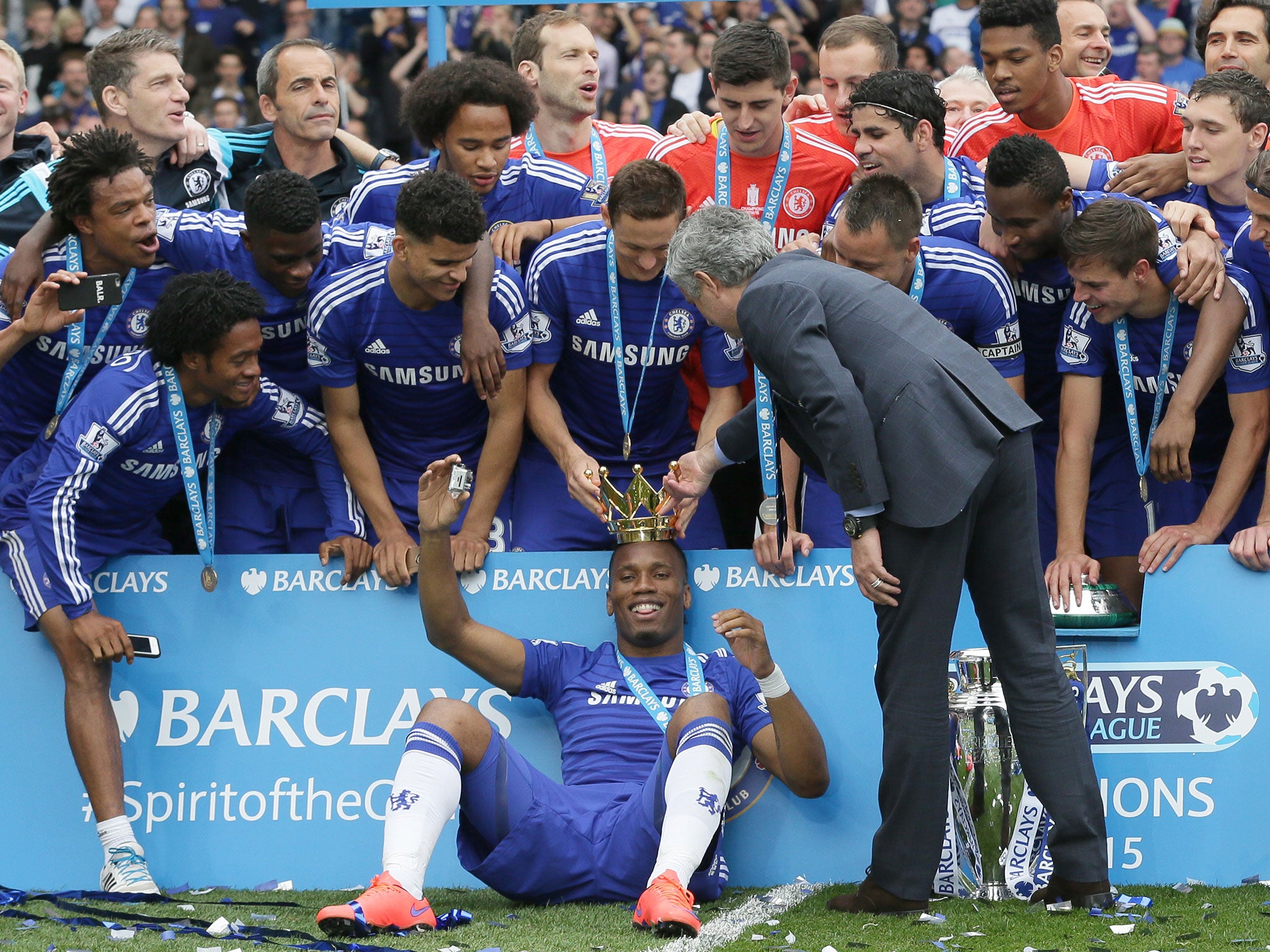 Chelsea players celebrate with the trophy after the English Premier League soccer match between Chelsea and Sunderland at Stamford Bridge stadium in London. Chelsea were awarded the trophy after winning the English Premier League