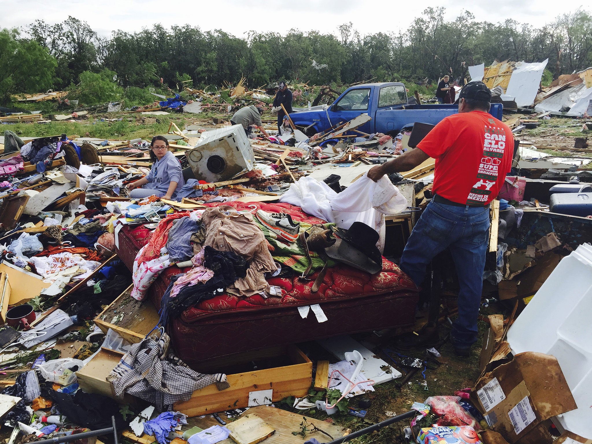 Residents sift through their belongings near Balsora