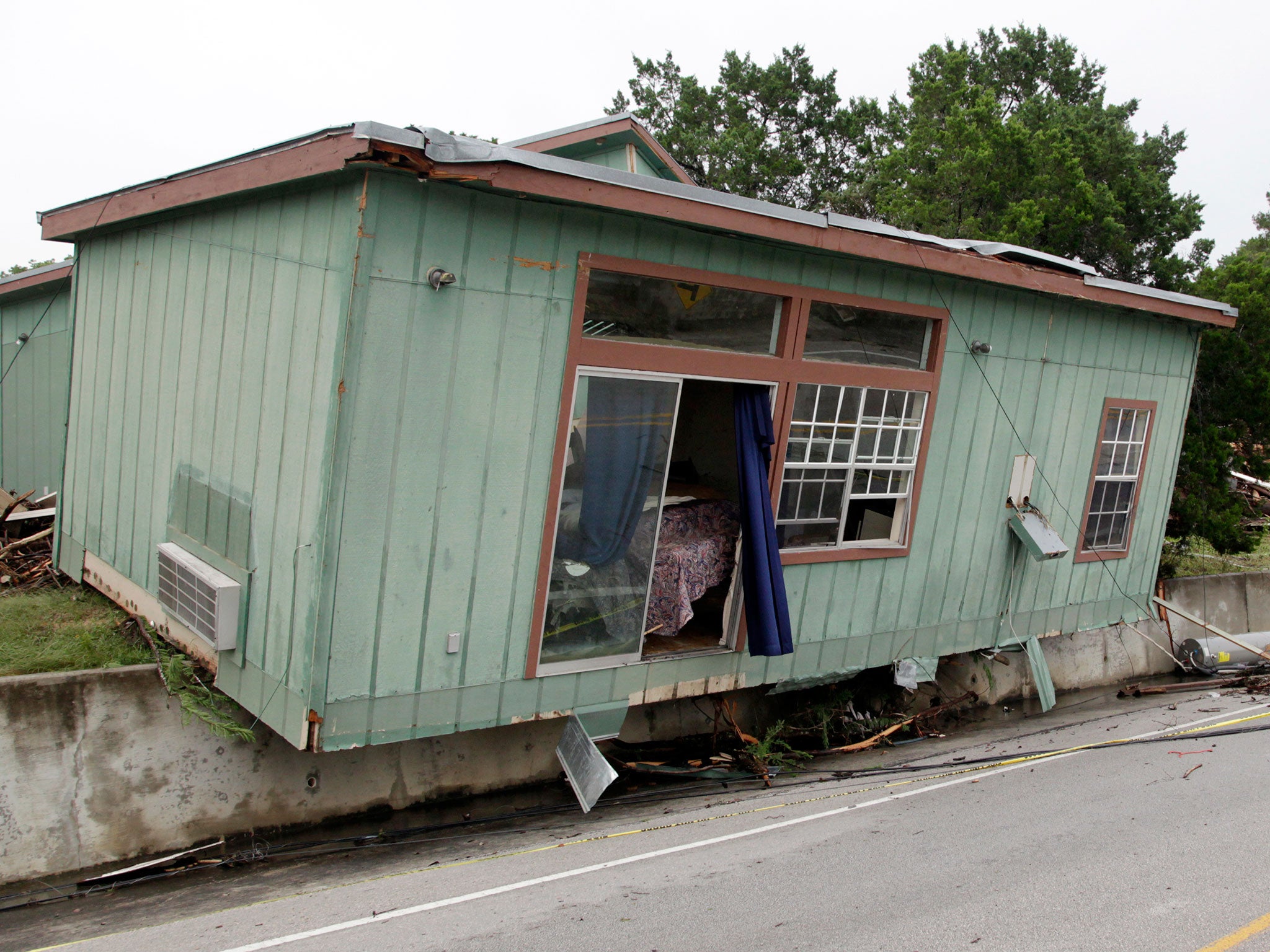 A cabin that was torn from its foundation in a flood on the Blanco River in Wimberley