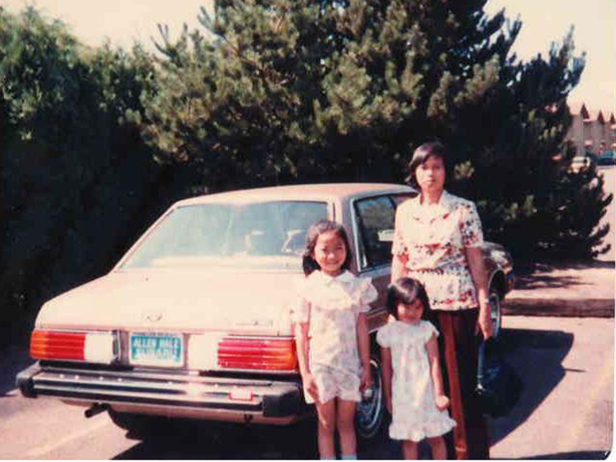 The family in America with their first car, a Nissan Sentra