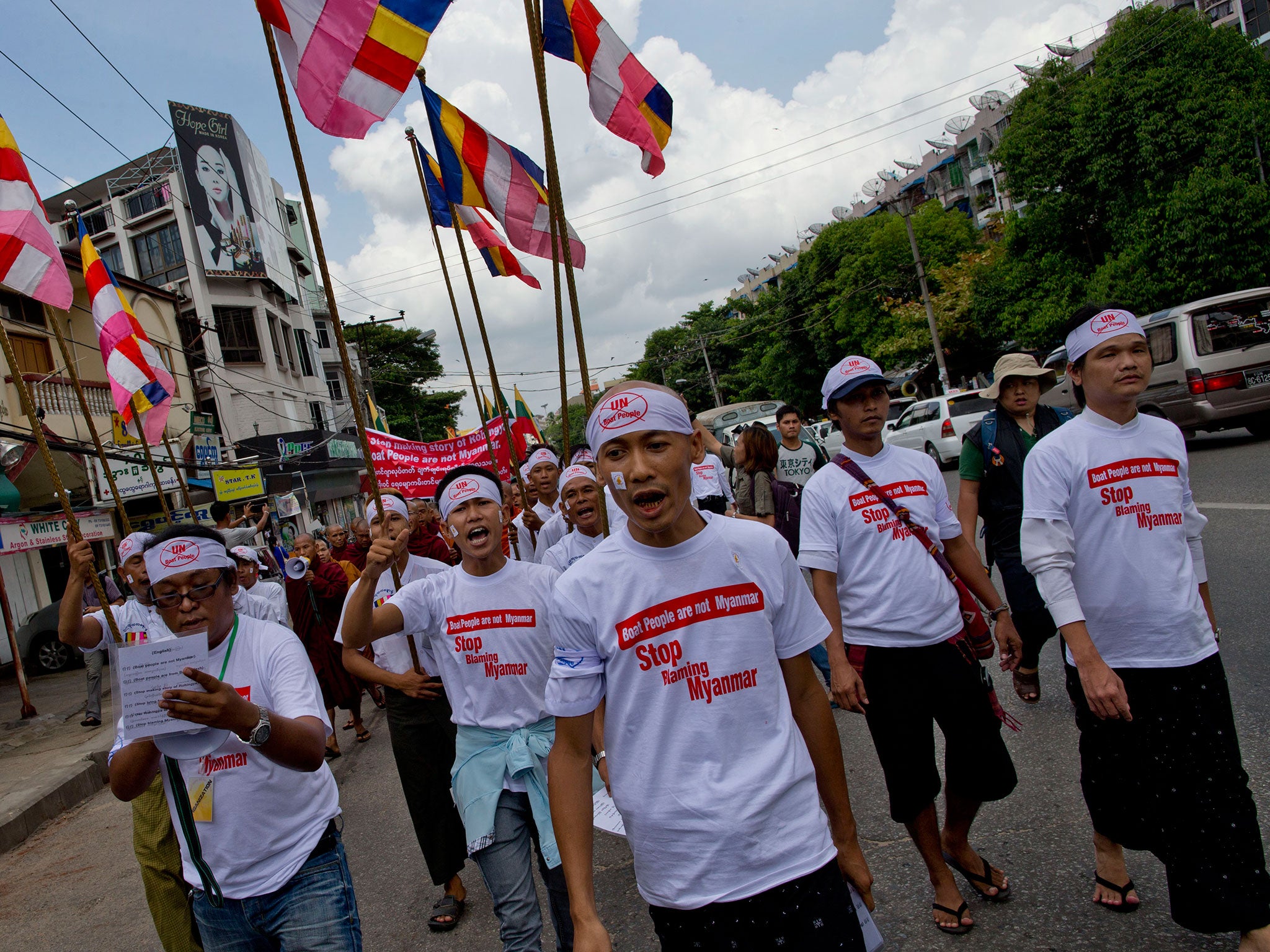 Buddhist nationalists shout slogans during a rally in Rangoon, Burma. Protesters, led by Buddhist monks, claim the boat people are from Bangladesh rather than Rohingya Muslims