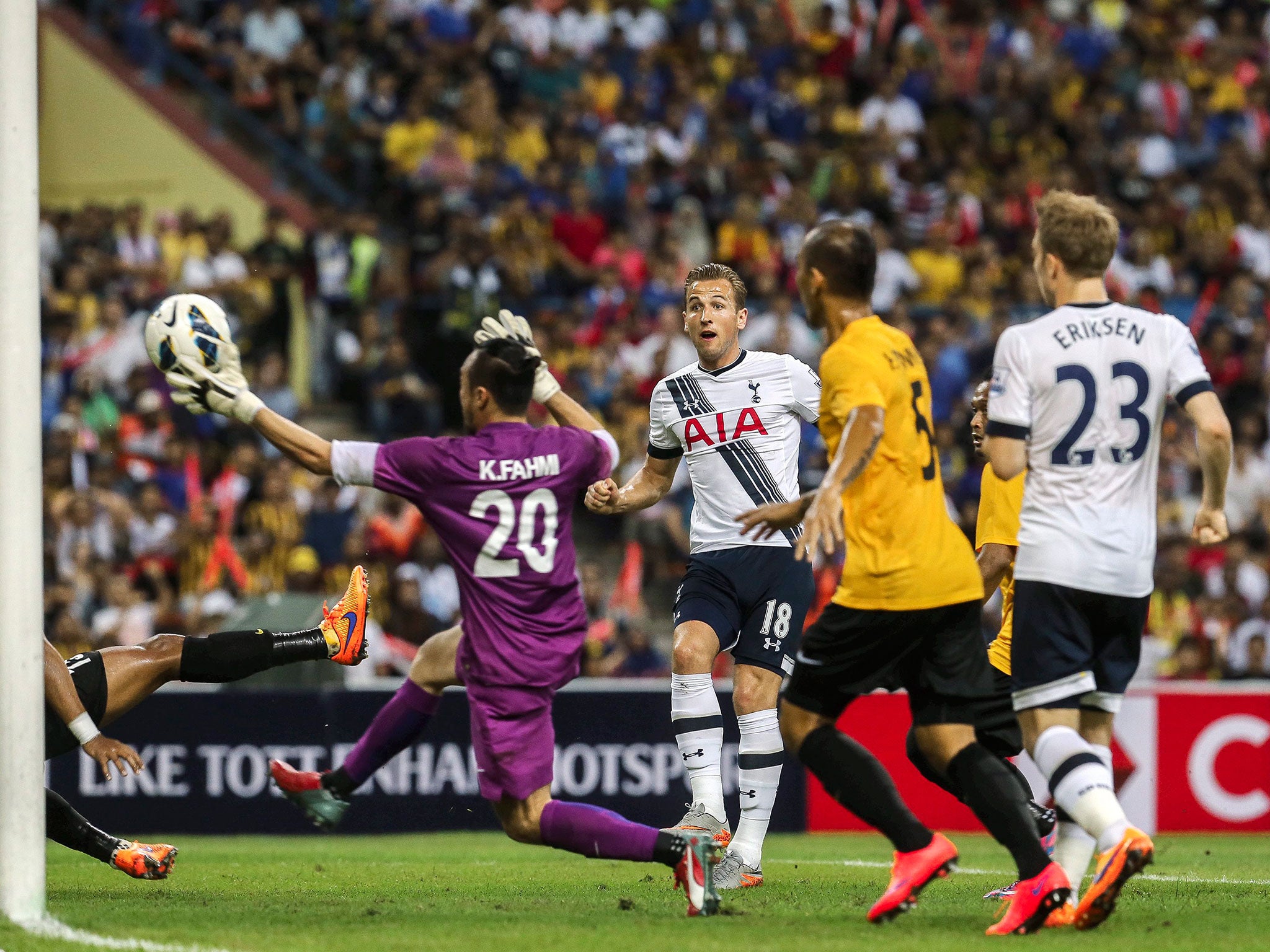 Harry Kane, centre, scores his first goal during the AIA Cup match between Tottenham Hotspur and a Malaysia XI at Shah Alam stadium