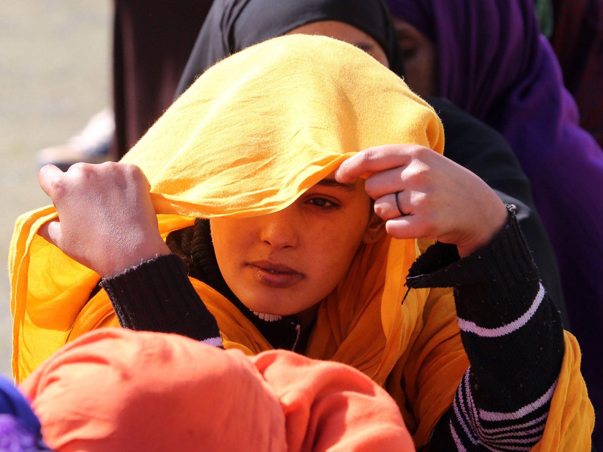 Migrants from sub-Saharan Africa hoping to board boats to Europe wait at a detention centre in Tripoli