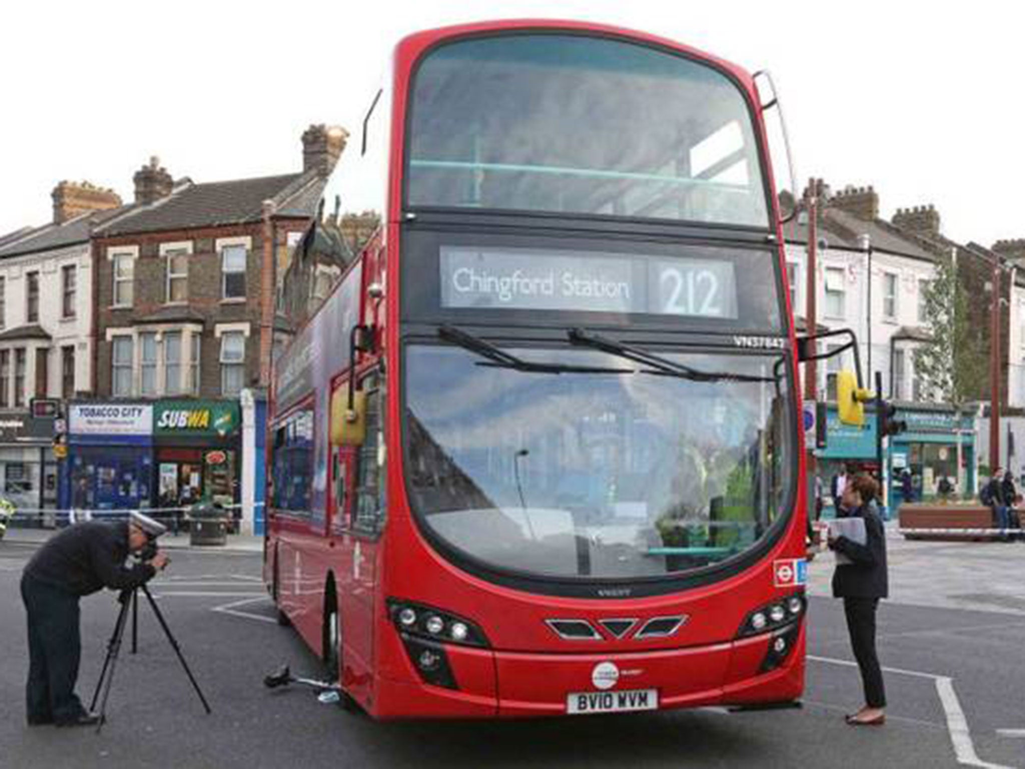 Police take photographs of the route 212 bus (Pic: Nigel Howard)