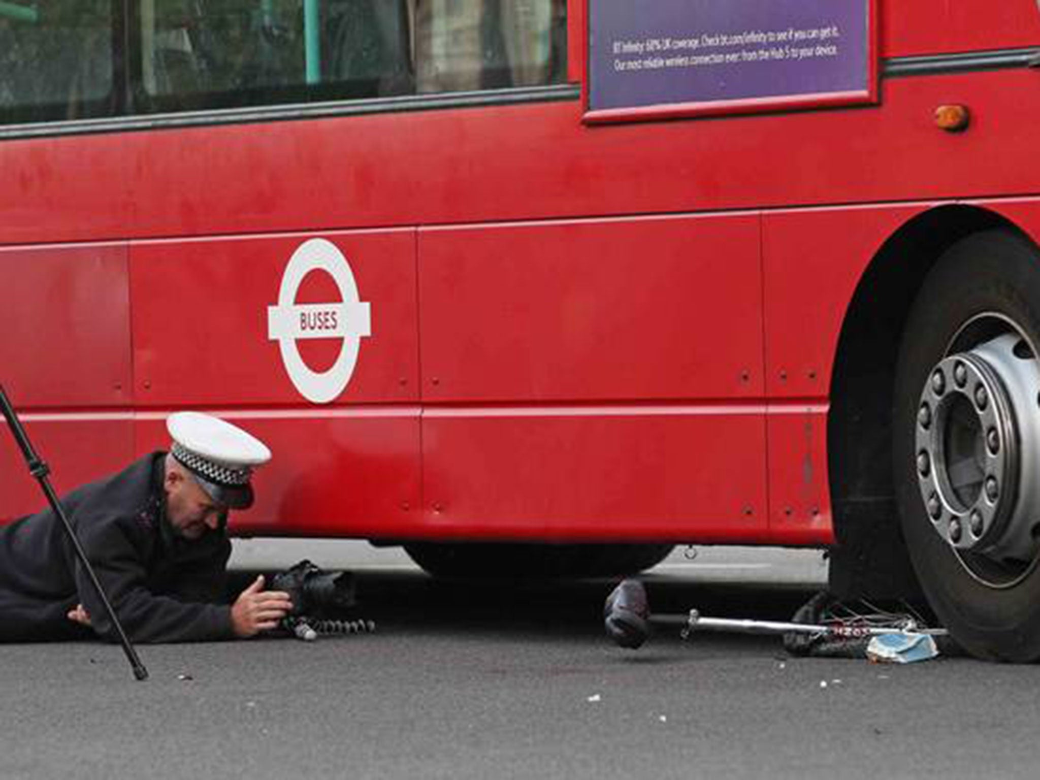 The unicycle is shown under the bus after the man riding it was freed (Pic: Nigel Howard)