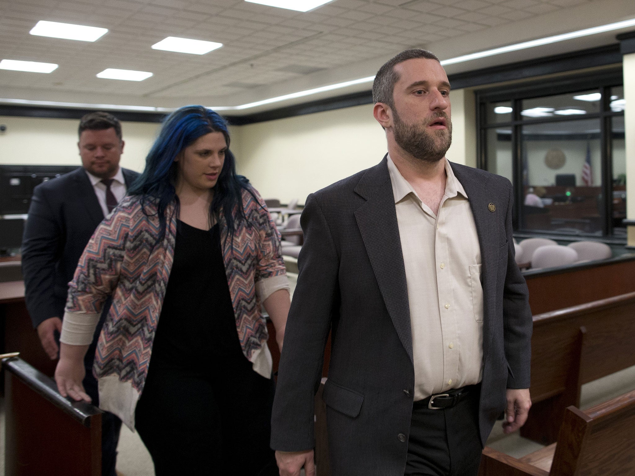 Dustin Diamond, with his fiancee Amanda Schutz and her attorney walk out of the coutroom after a split verdict in an Ozaukee County Courthouse May 29, 2015