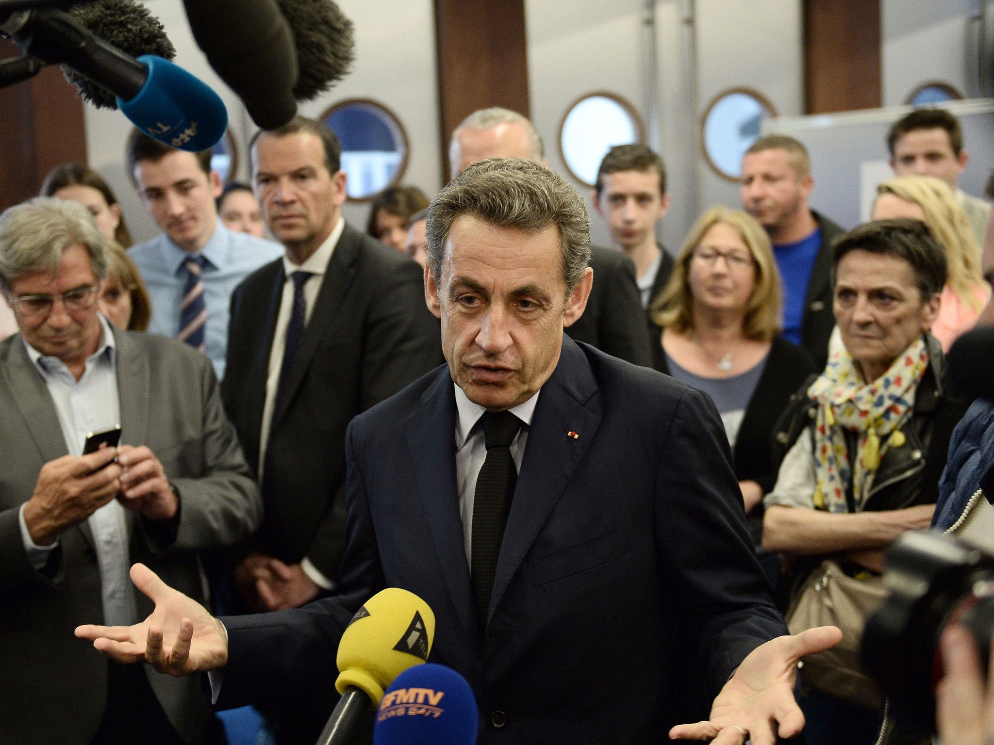 Nicolas Sarkozy speaks to the press at the UMP headquarters before the party conference where the new name was voted for.