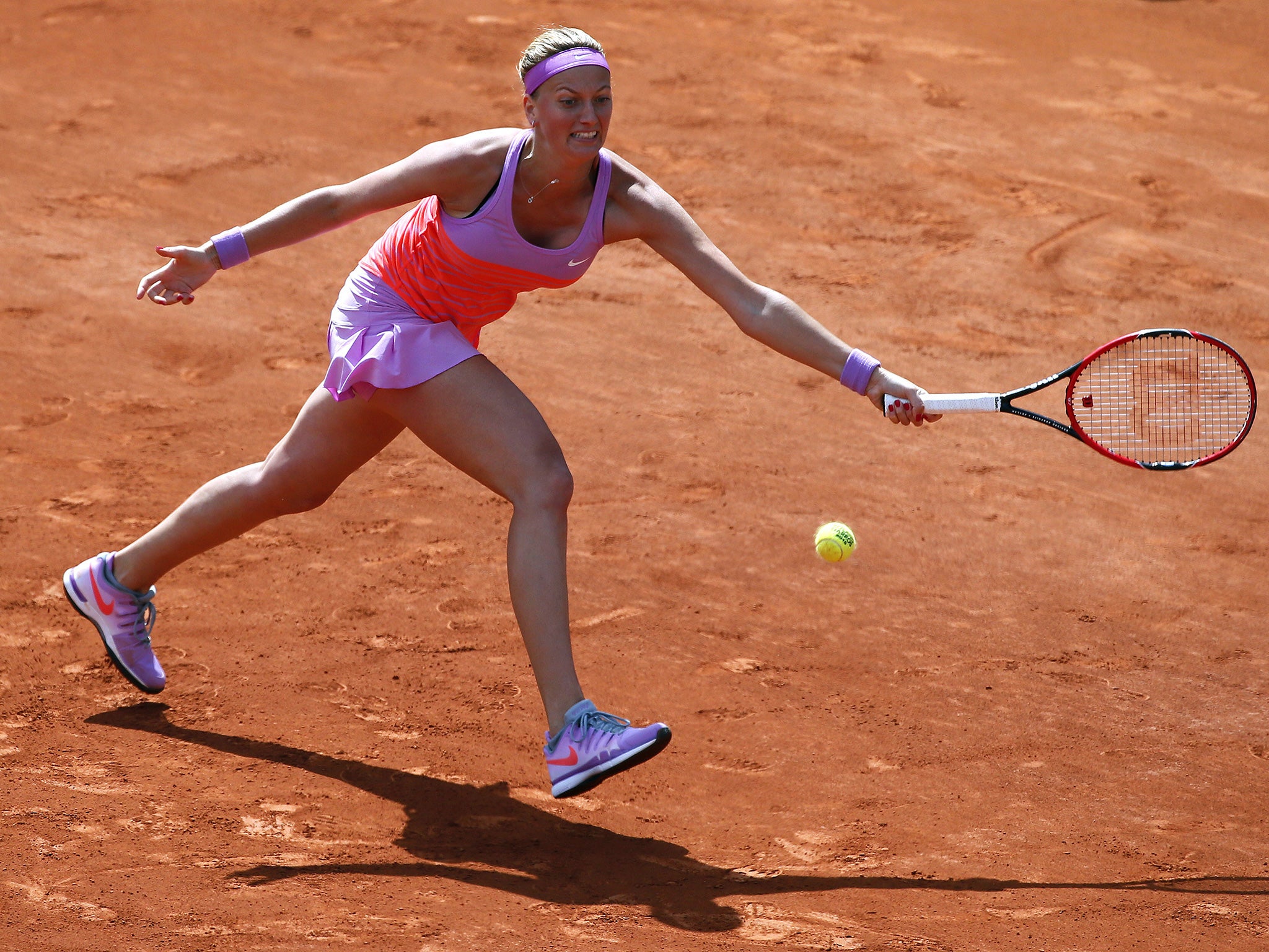 Petra Kvitova returns the ball to Romania's Irina-Camelia Begu