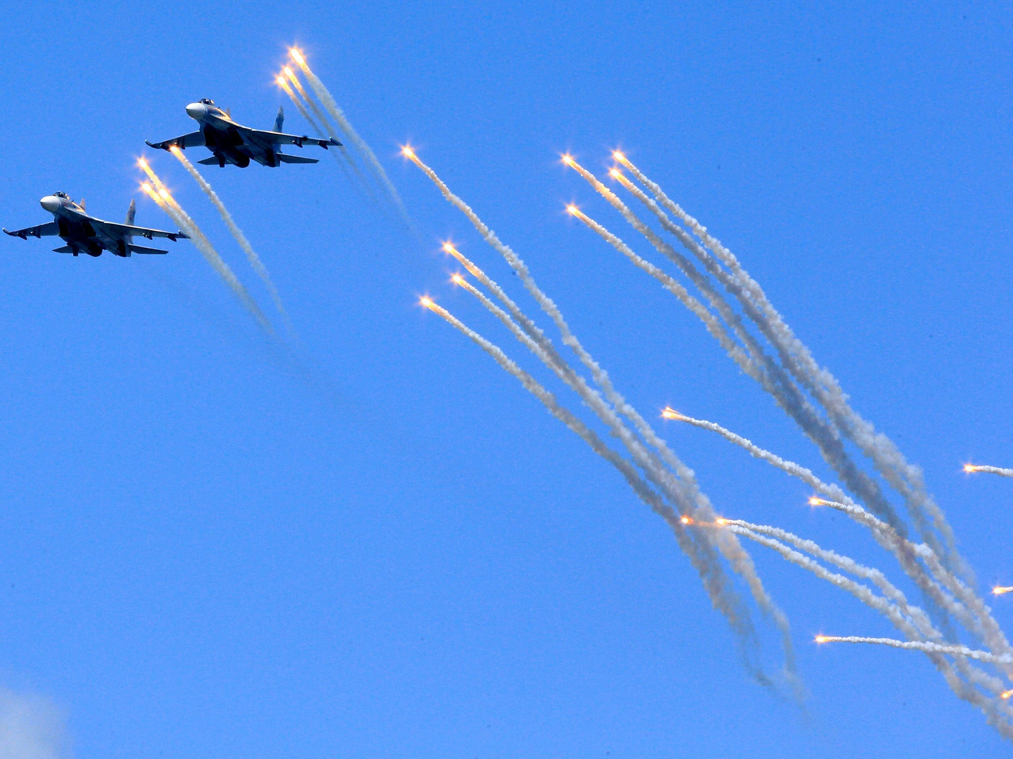 File: Russian Su-24 frontline bombers at a rehearsal of the navy's Victory Day Parade on 7 May 2015