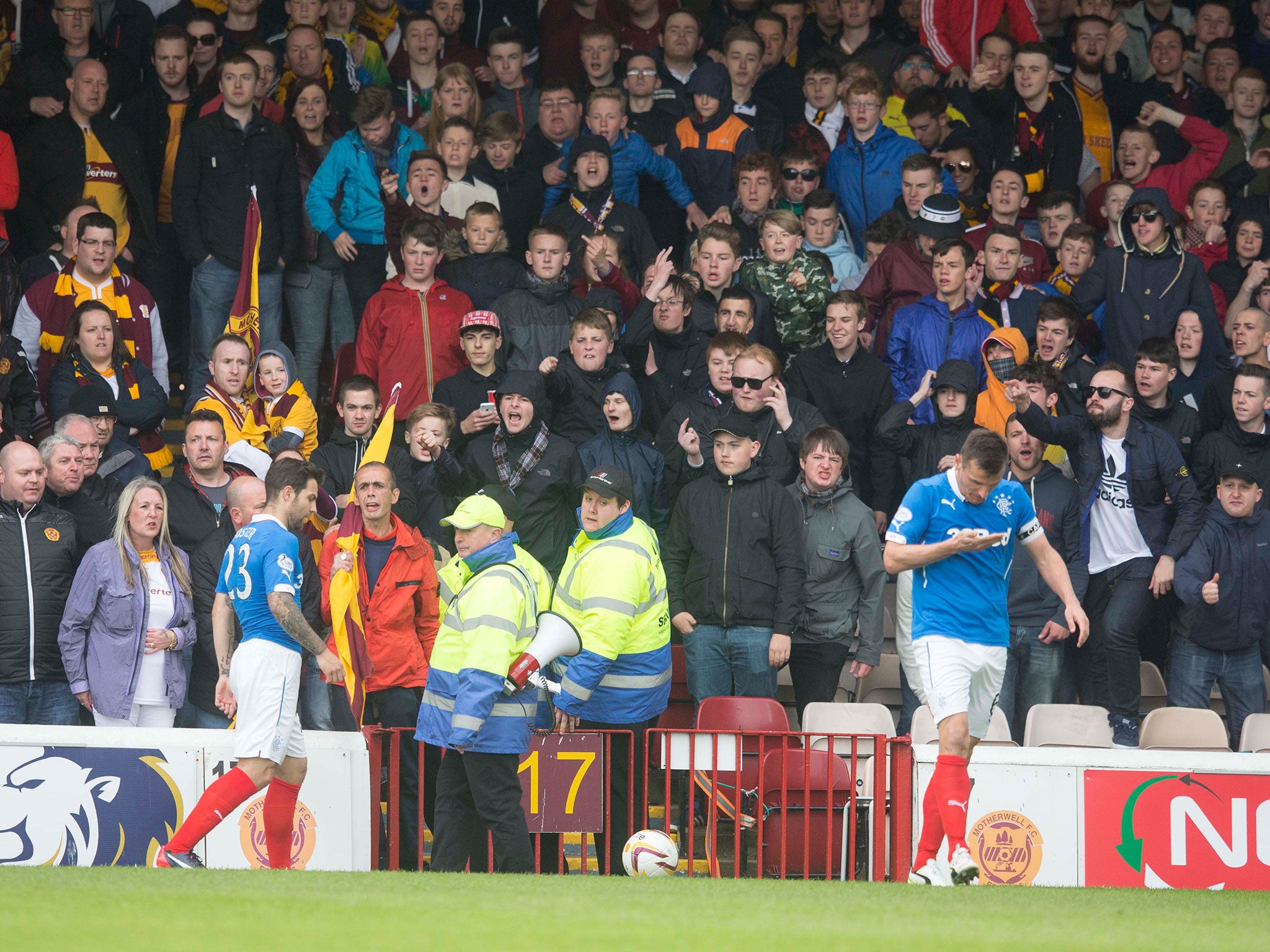 Lee McCulloch of Rangers walks away after altercation with Motherwell fans