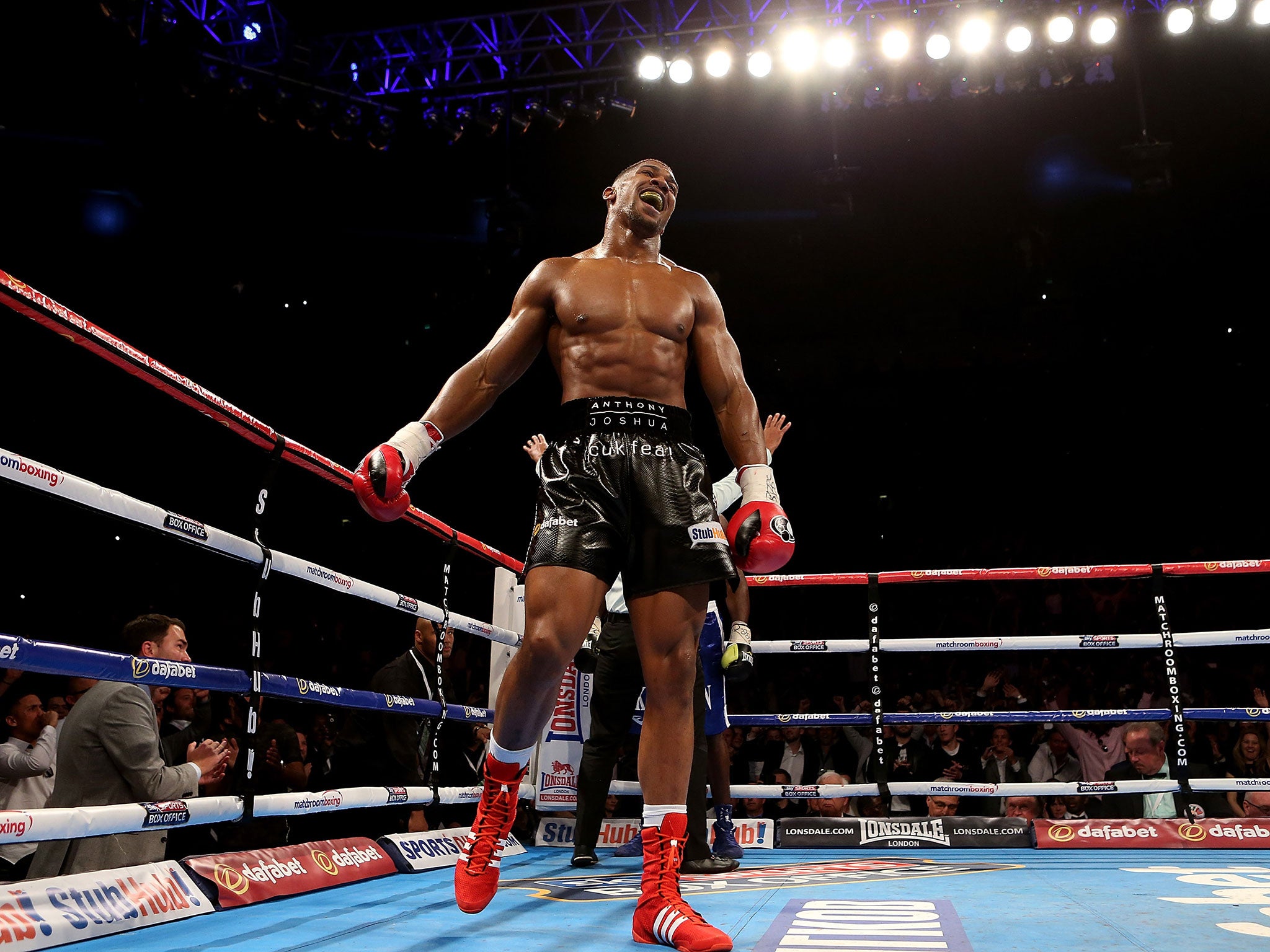 Anthony Joshua celebrates after defeating Kevin Johnson