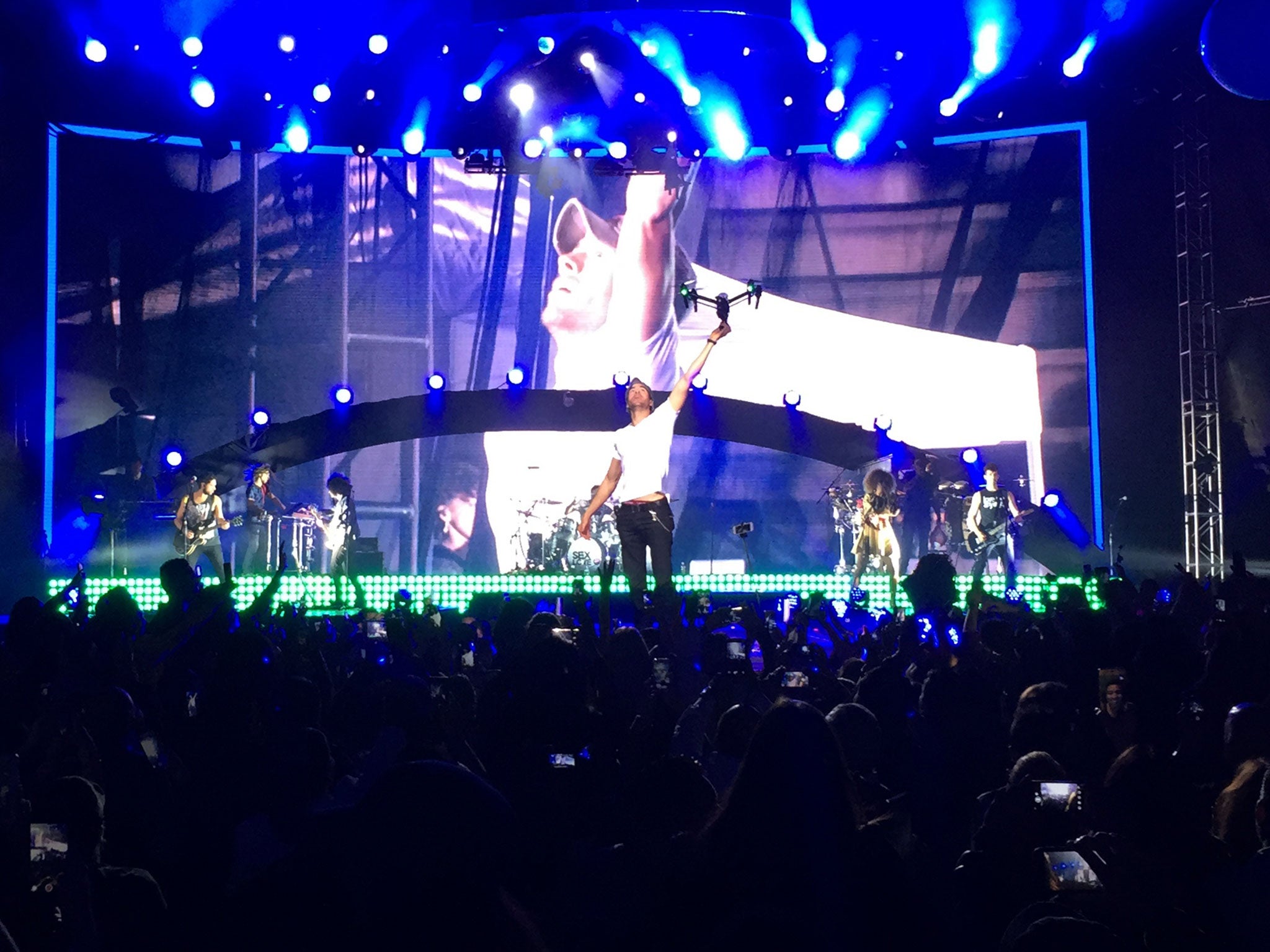 Enrique Iglesias grabs a drone onstage during a concert in Tijuana, Mexico