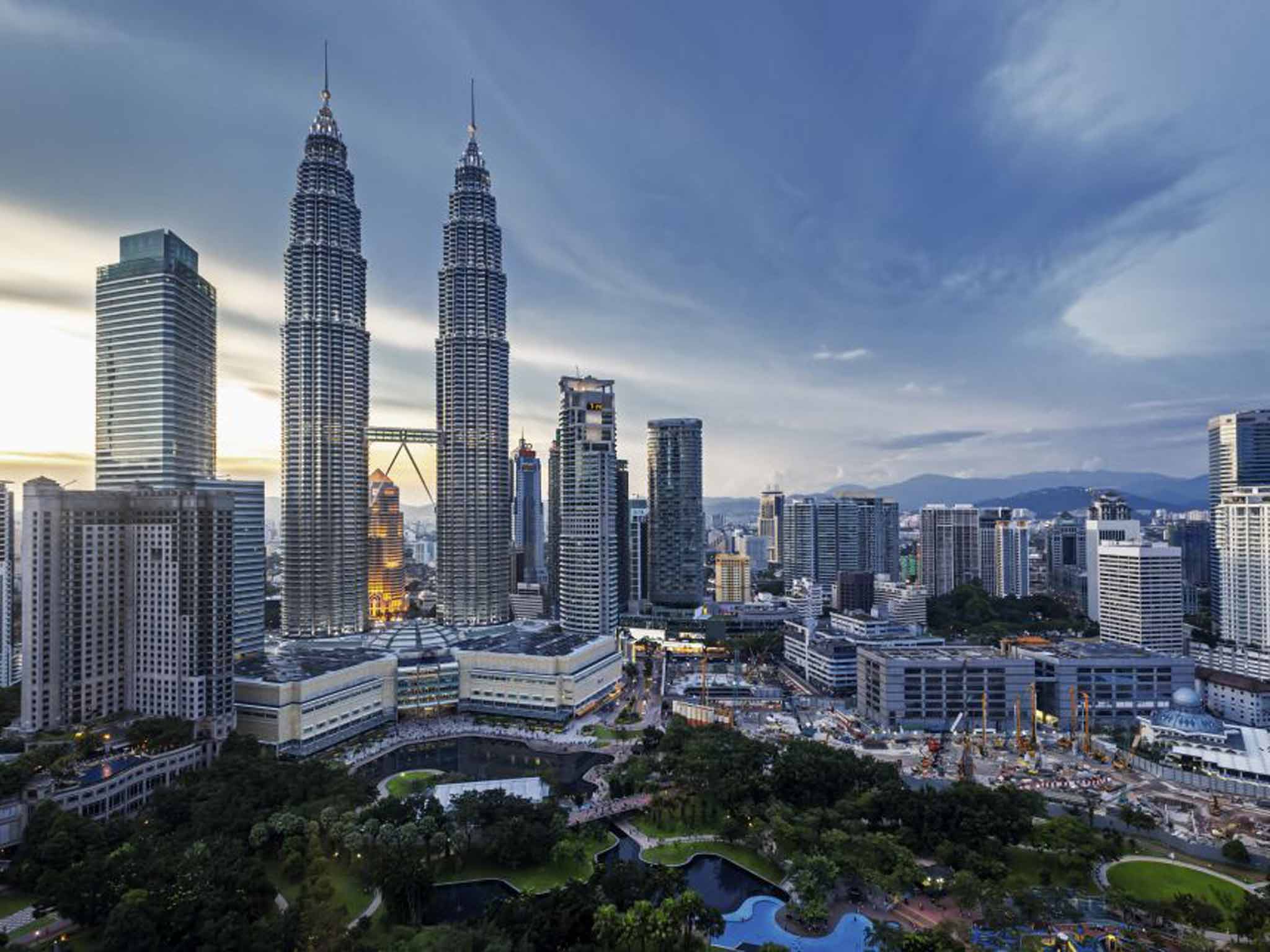 The Petronas Twin Towers rise above the city