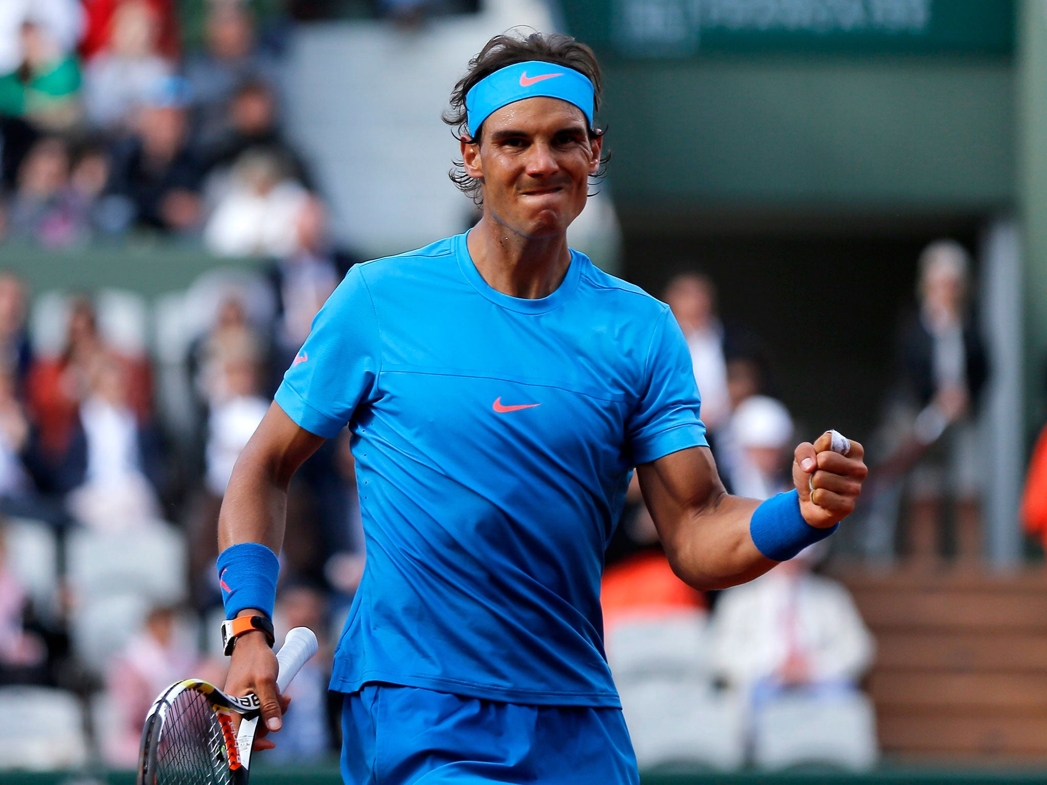 Rafael Nadal celebrates after winning a point on his way to victory against Jack Sock