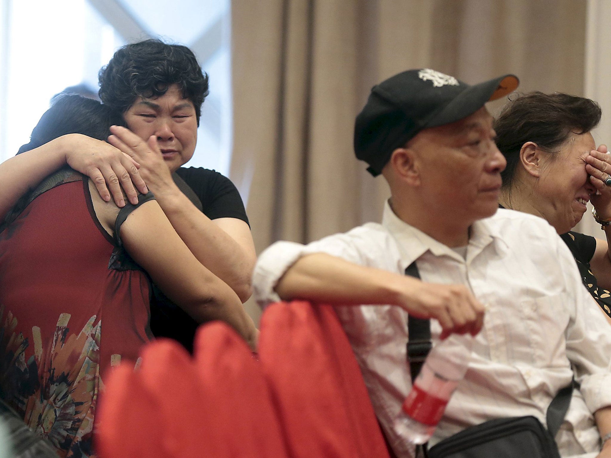 Relatives of passengers on the ship that sank at Jianli section of Yangtze River