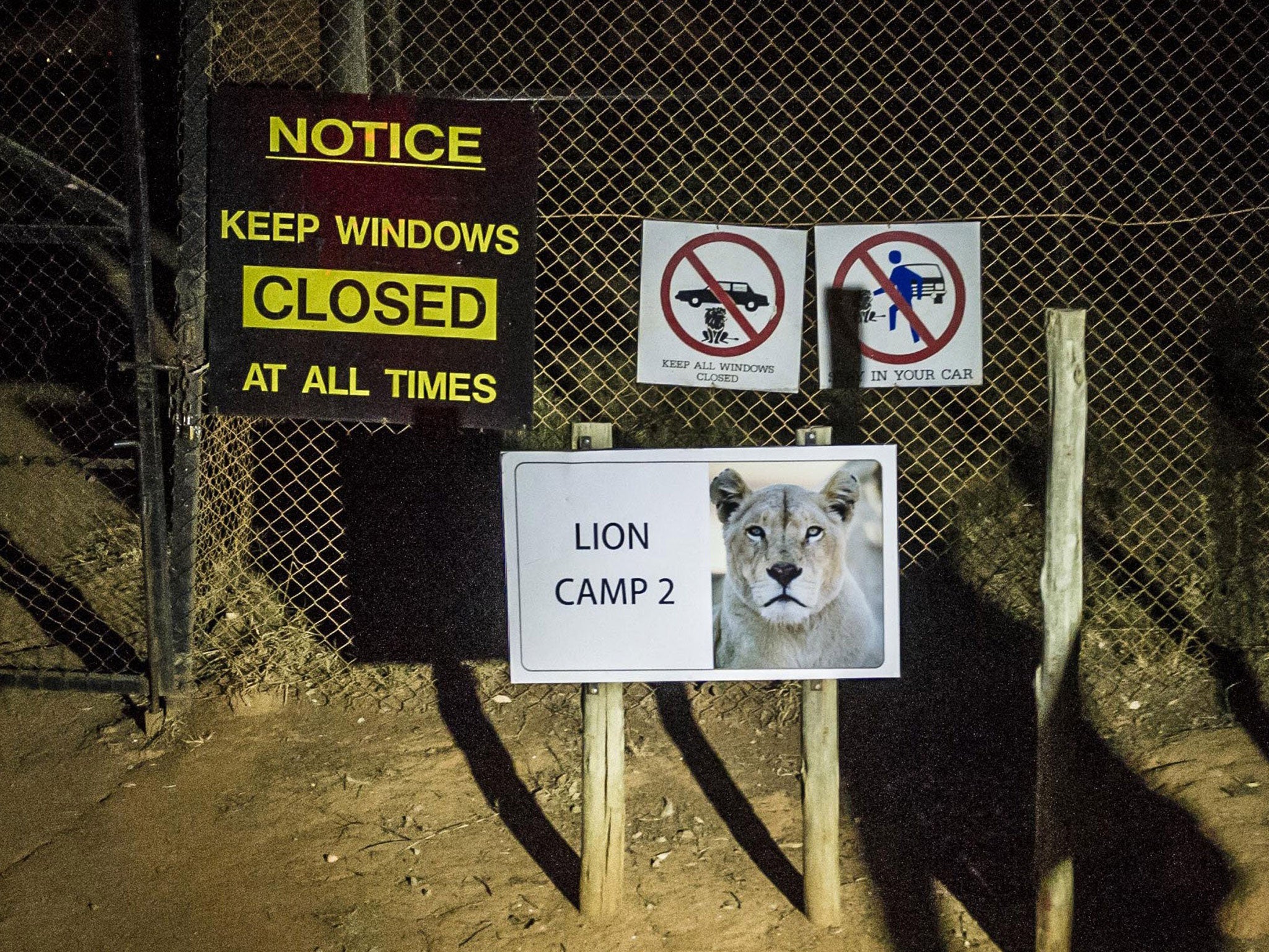 Signs at the entrance to the park, which reopened for business 'as usual' on Tuesday, warn visitors to keep windows closed at all times