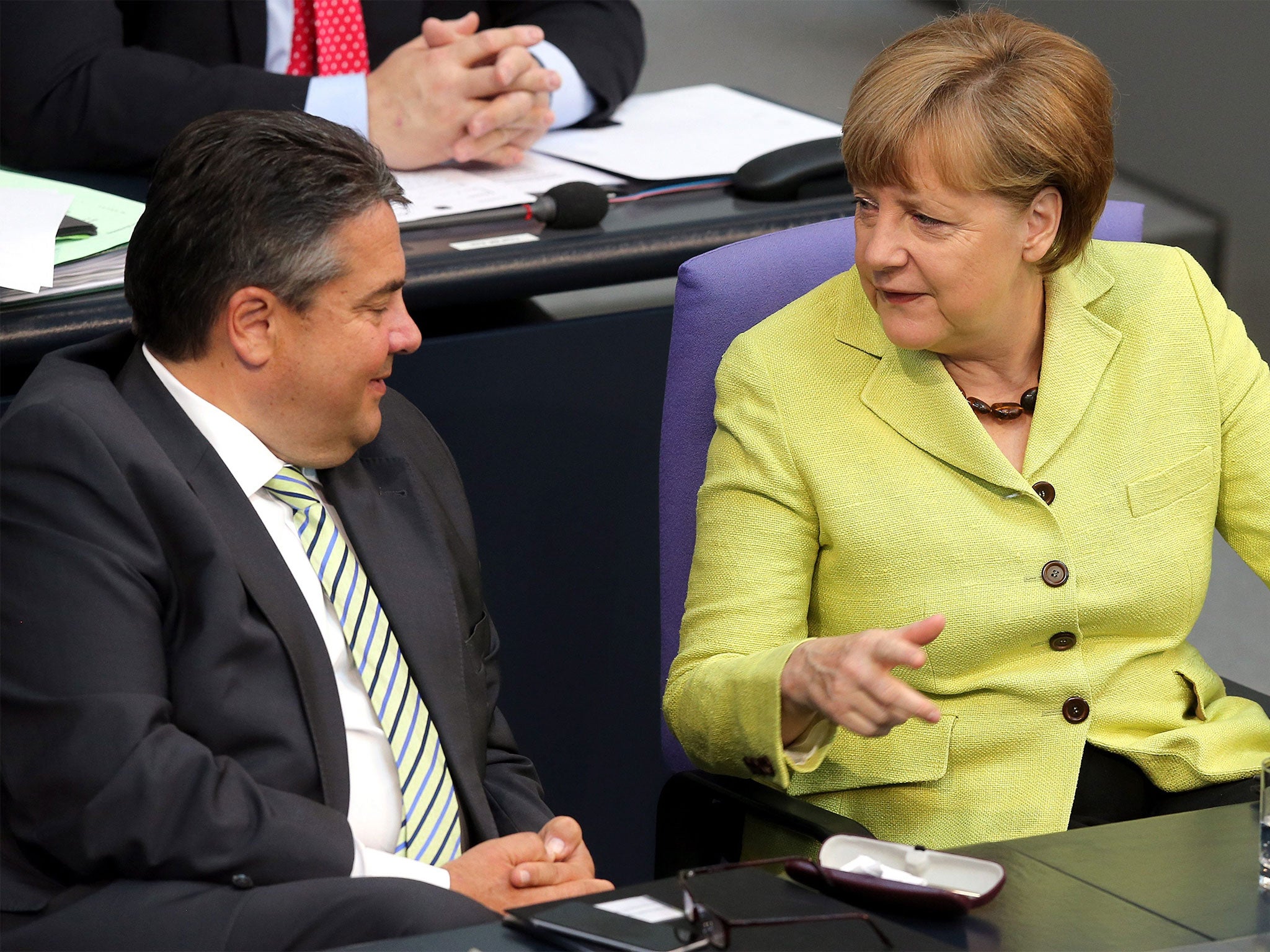 Vice-Chancellor Sigmar Gabriel speaks with Angela Merkel