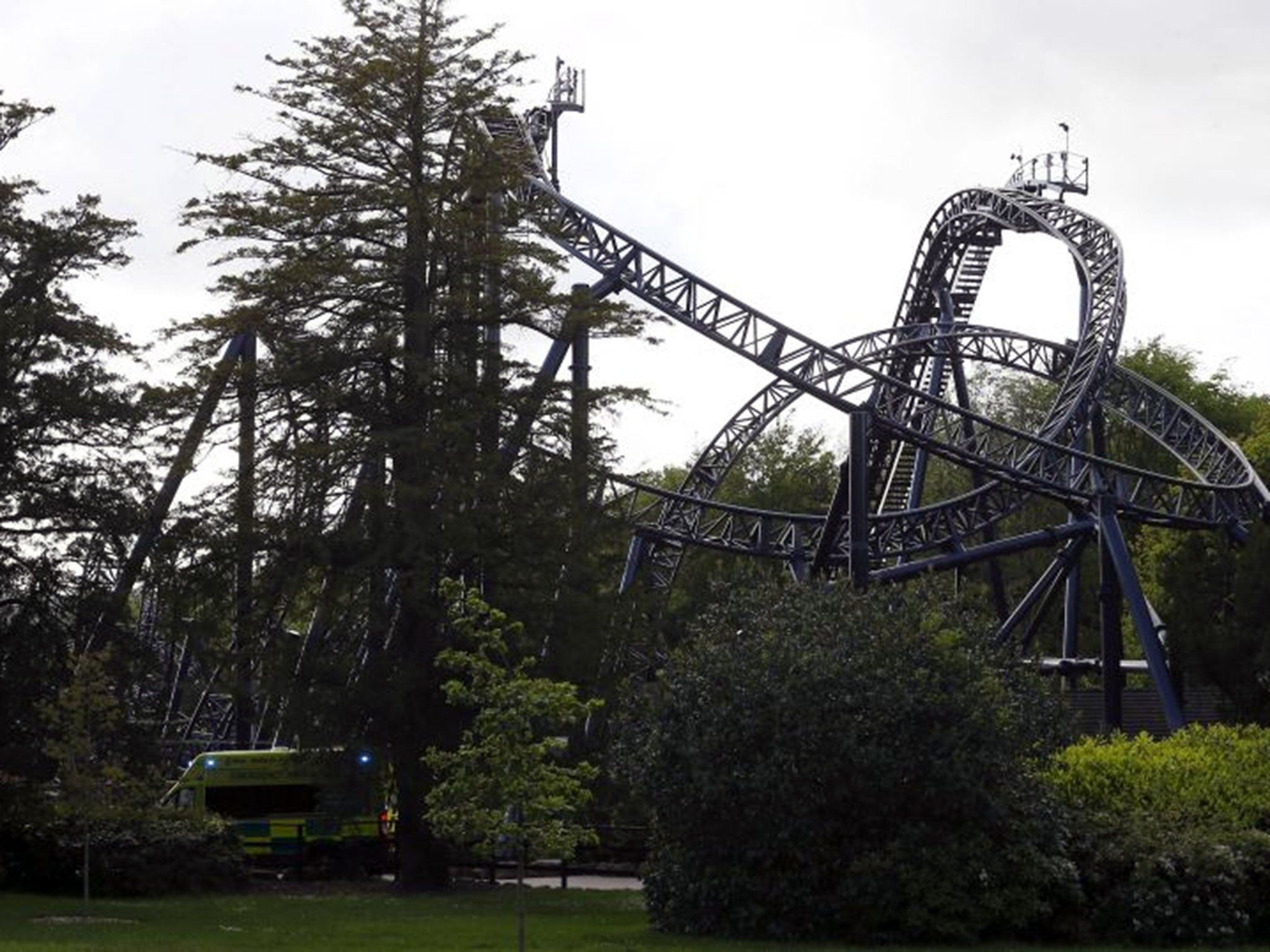 An ambulance drives past the Smiler ride at Alton Towers after the crash