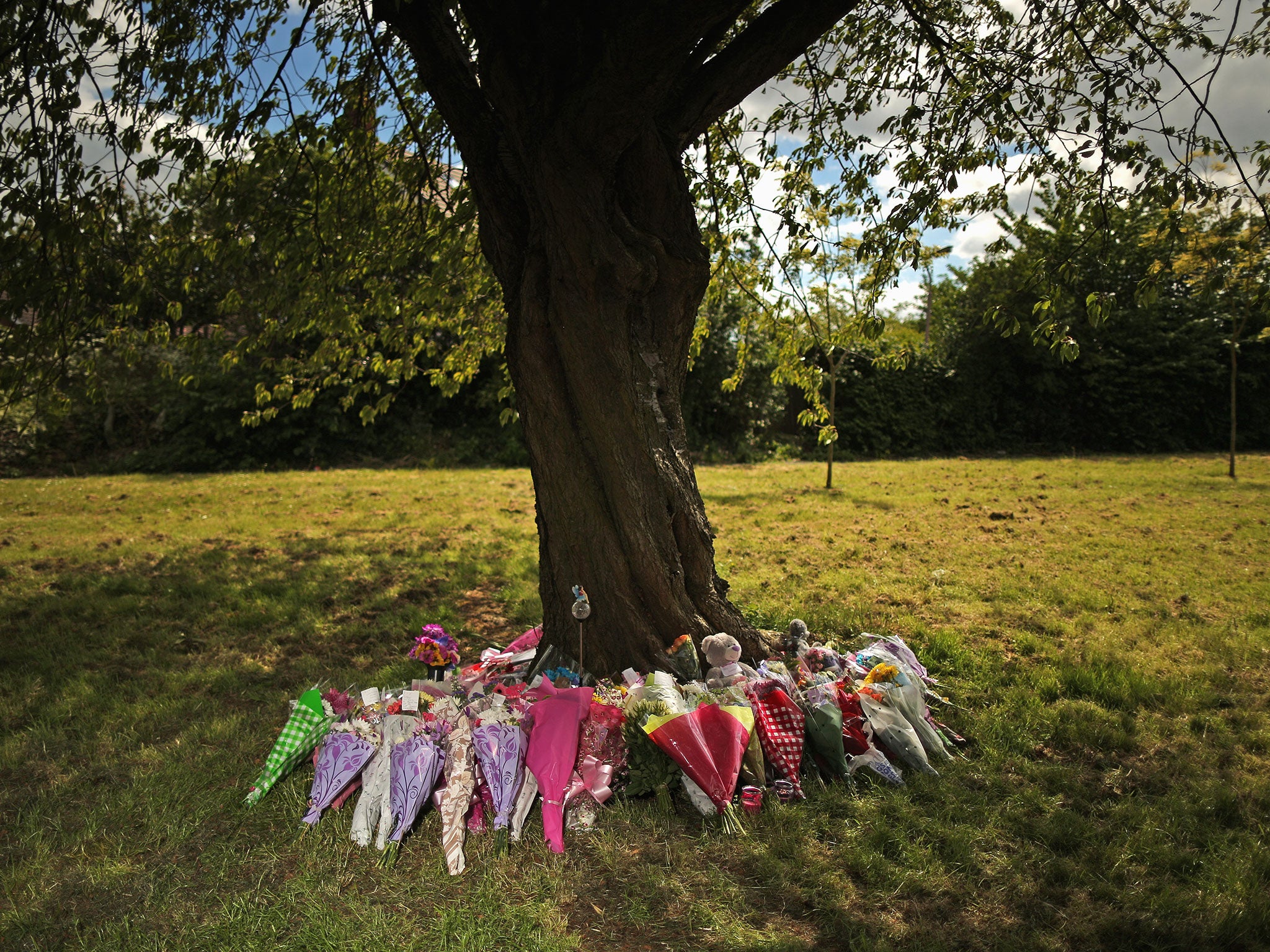 Flowers and tributes lay at the scene in Westfield Lane, Mansfield, where a body was found during the search for missing 13-year-old girl Amber Peat in Mansfield.