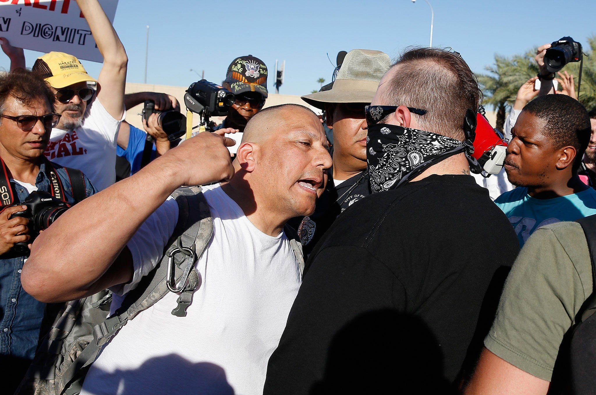 Protesters and counter-protesters argue outside the Islamic Community Center in Phoenix, Arizona