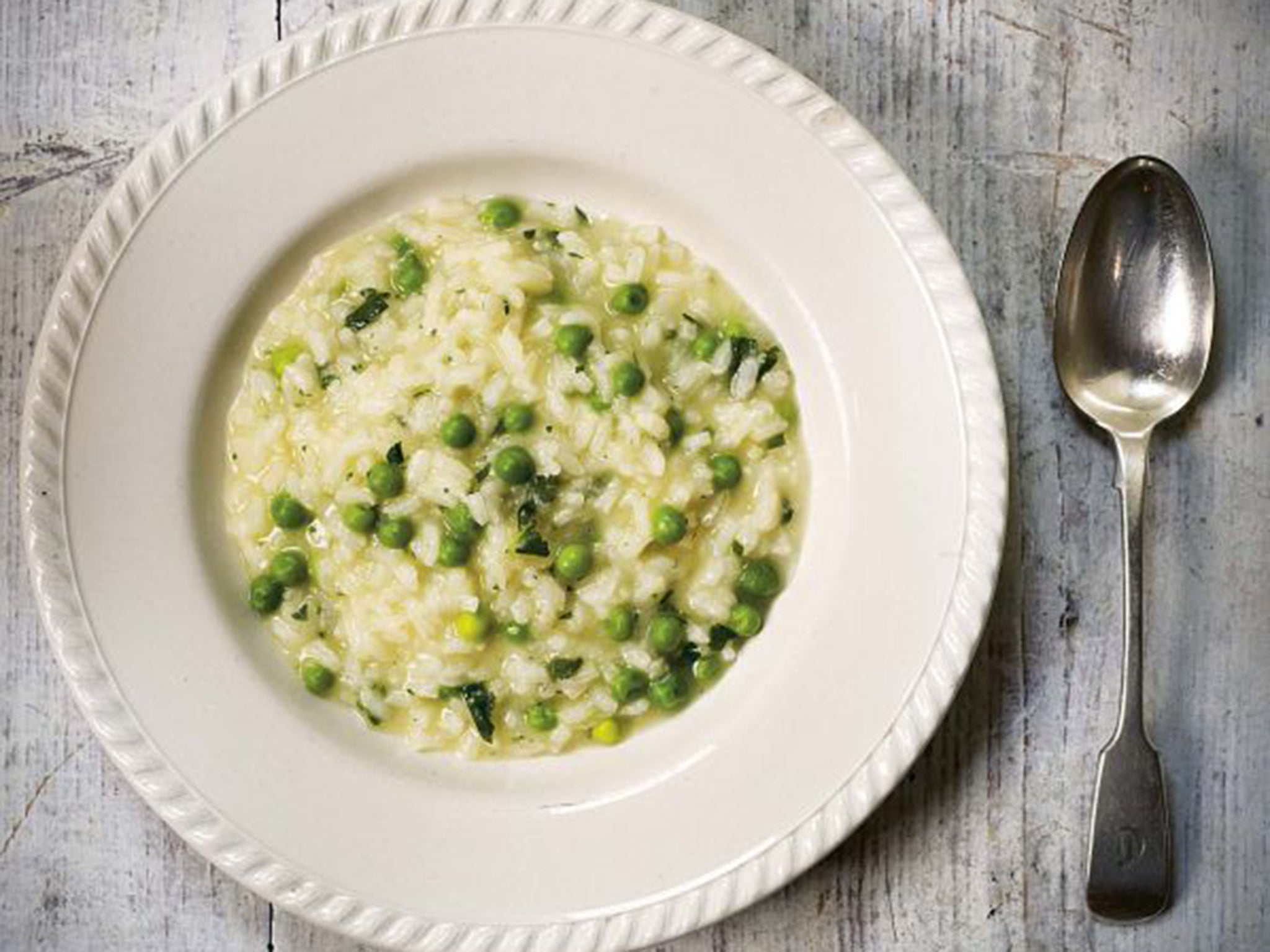 Risi e bisi is a luminous green pea risotto with a soupy consistency