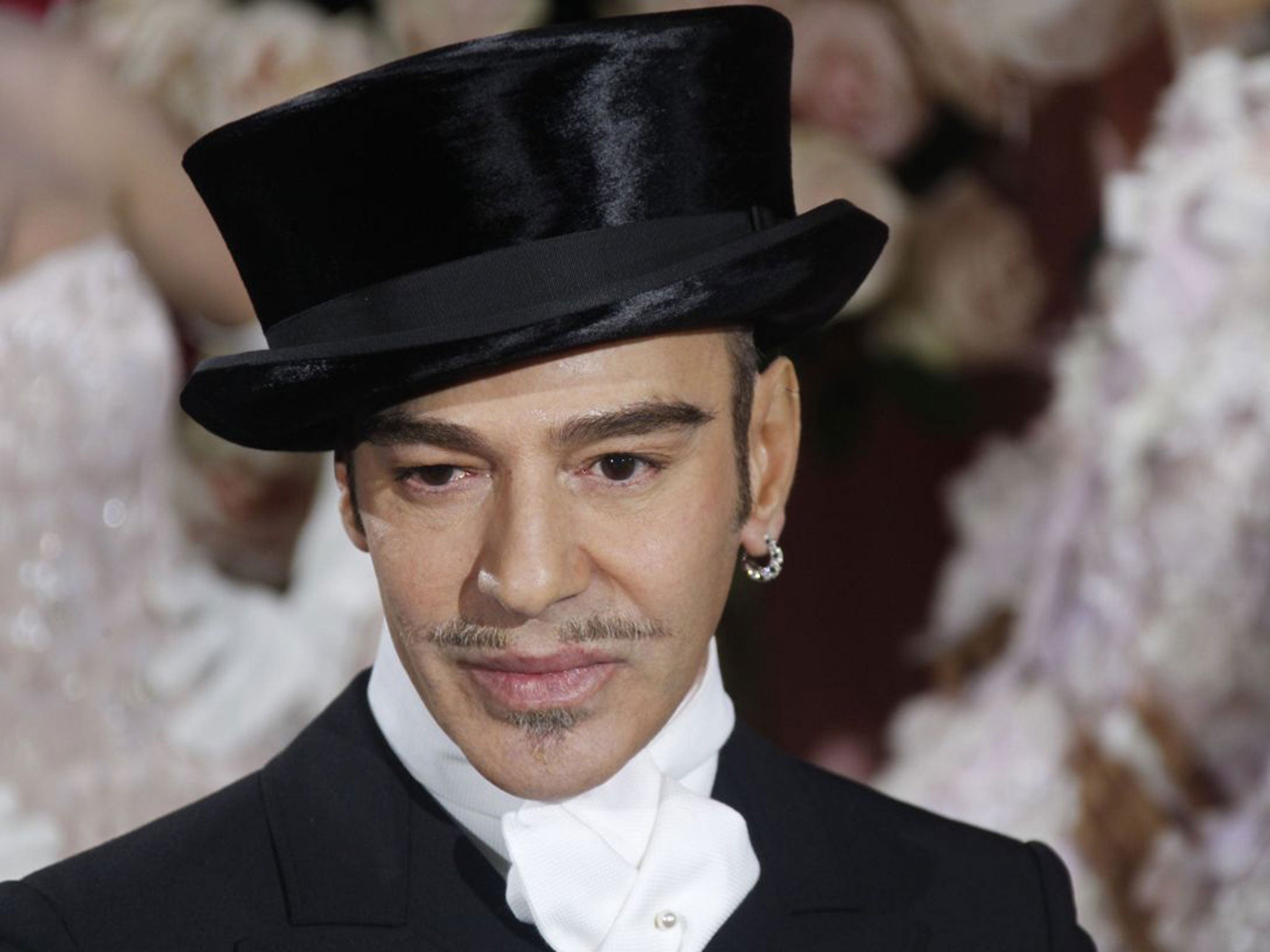 John Galliano acknowledges the audience following the Christian Dior spring-summer 2010 haute couture collection show