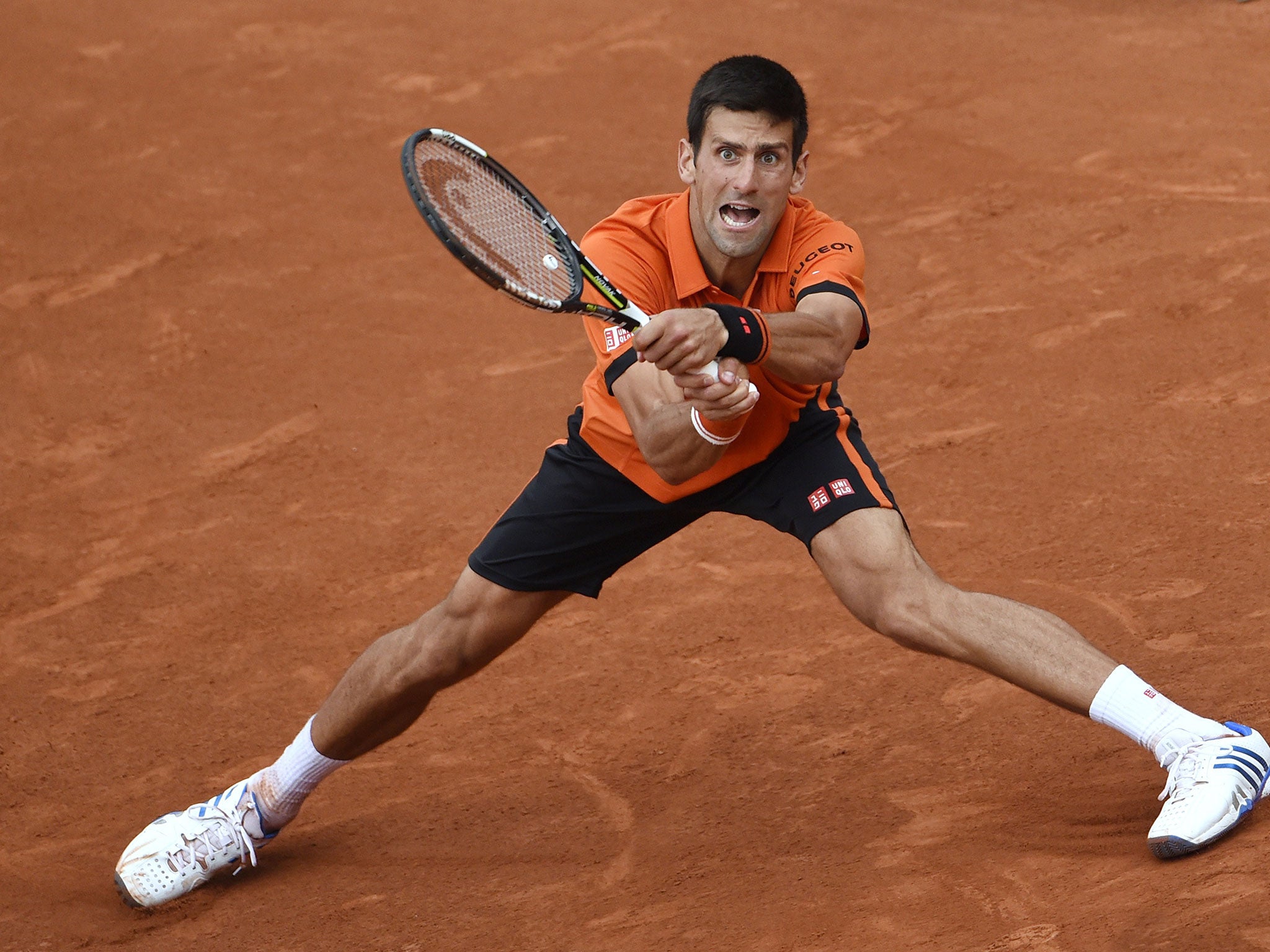 Novak Djokovic plays a return