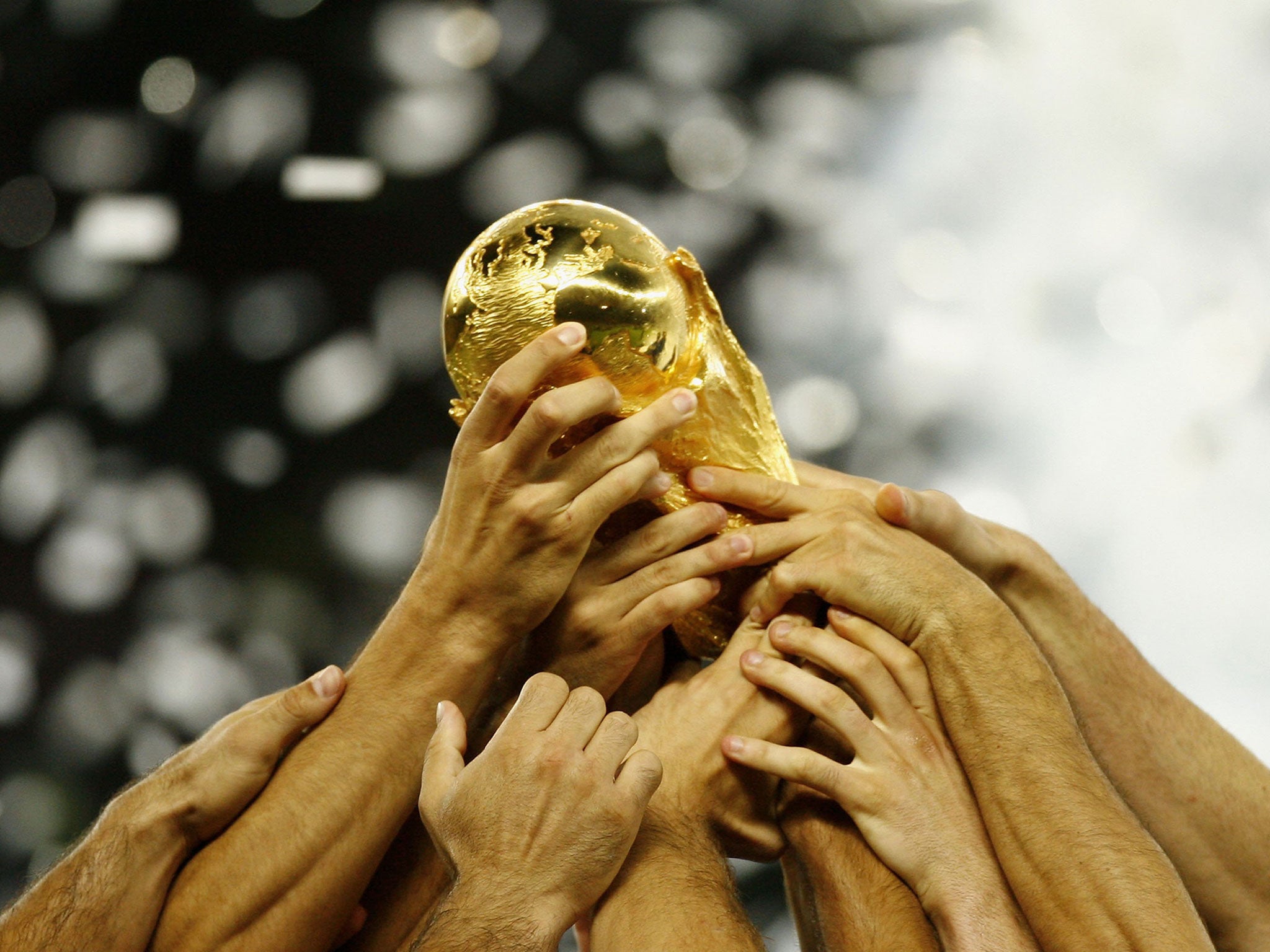 Italian players celebrate with the world cup trophy, following their team's victory during the FIFA World Cup Germany 2006 Final match between Italy and France at the Olympic Stadium on July 9, 2006 in Berlin, Germany