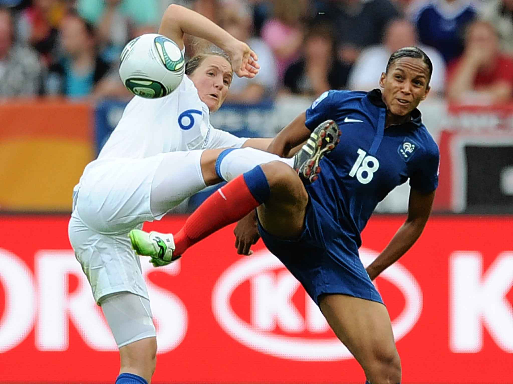 Casey Stoney (left) contests possession with France striker Marie-Laure Delie in the 2011 World Cup encounter