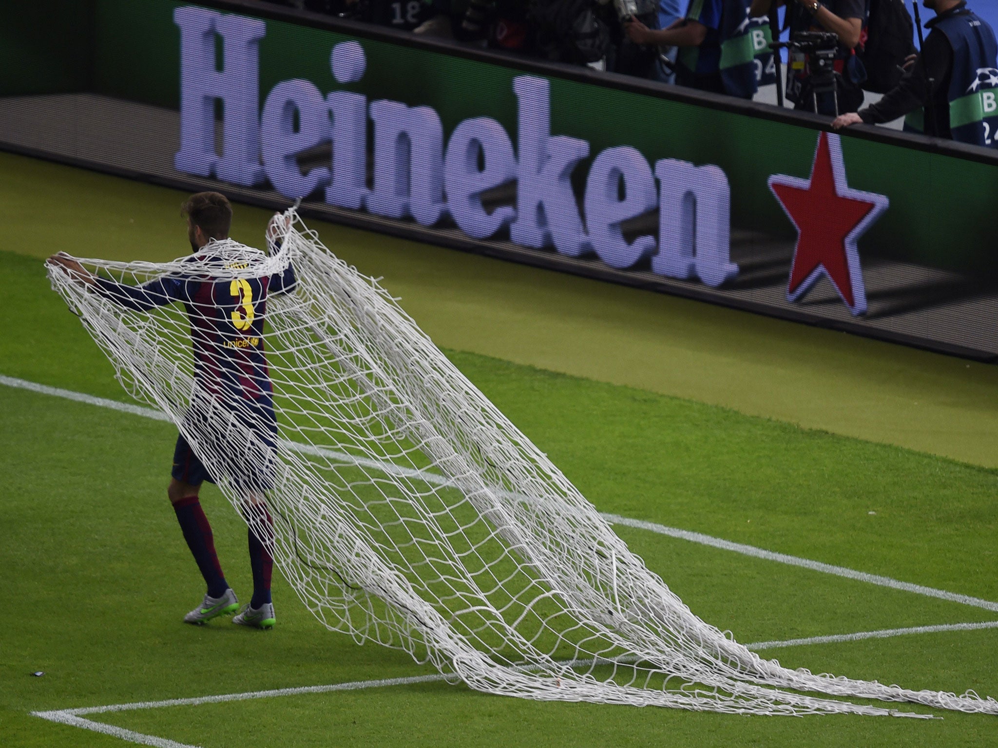 Gerard Pique with the goal net after the Champions League final win over Juventus